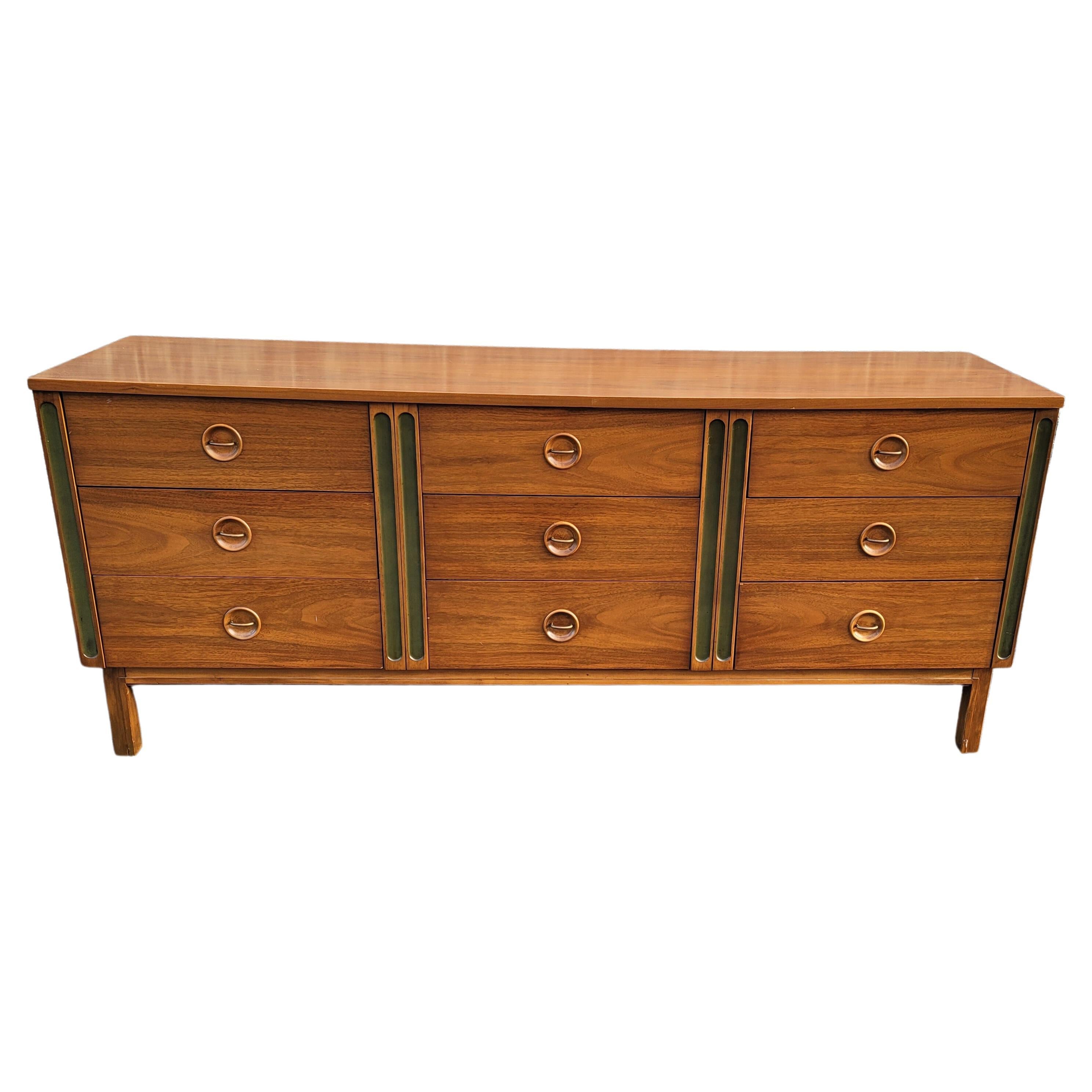 A rare danish teak dresser by Arne Vodder for Sibast Mobelfabrik, 1950s. This elegant Danish Modern nine-drawer triple dresser is in very good vintage condition. Would look great in any Mid-Century Modern home or apartment. Very well made and