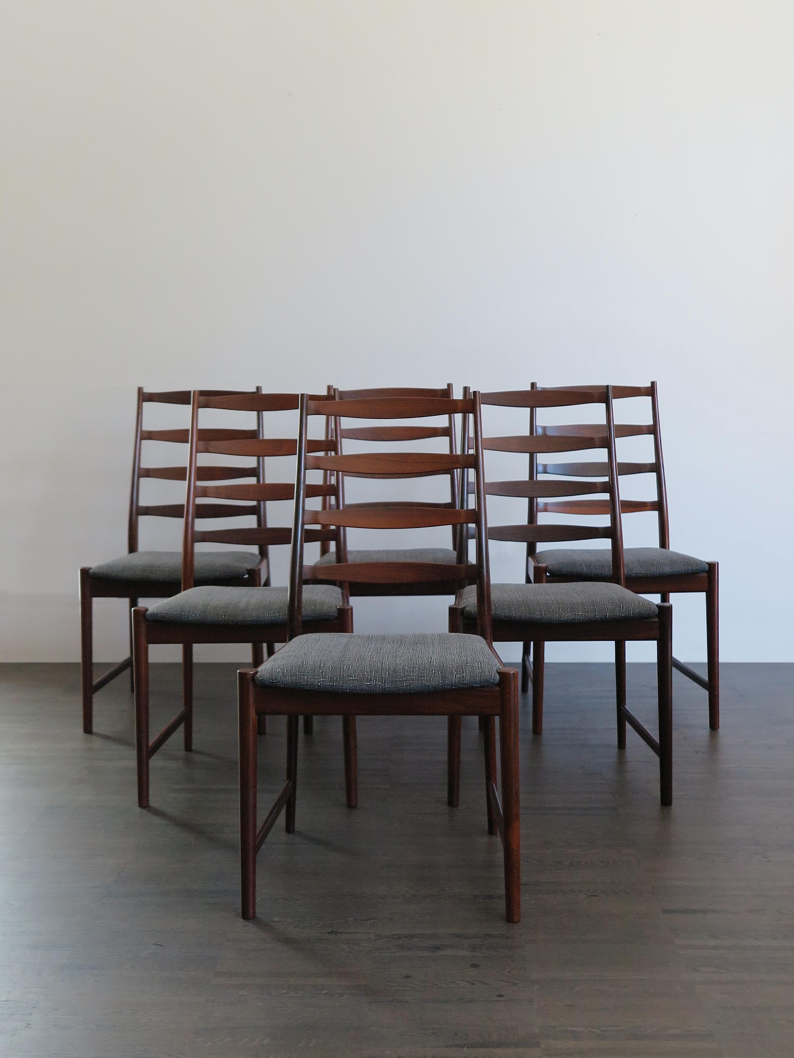 Set of six Scandinavian solid wood dining chairs, designed by Arne Vodder, manufacturer’s logo printed on the bottom and new lining fabric, Denmark 1960s

Please note that the chairs are original of the period and this shows normal signs of age