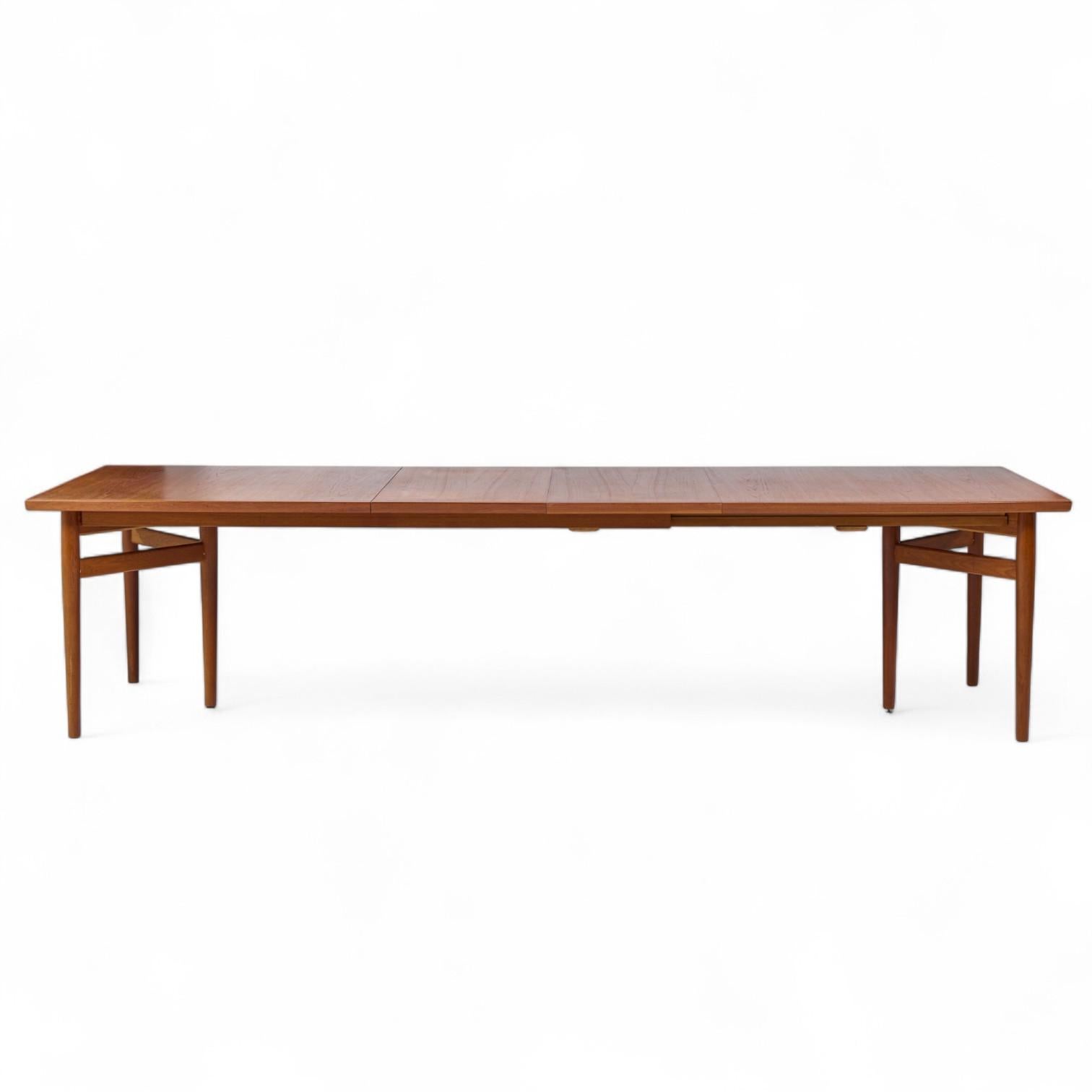 Arne Vodder Model 212 Mid Century Danish Teak Expanding Dining Table with 2 Leaves

This table measures: 78.75 wide x 40.75 deep x 28.5 inches high, with a chair clearance of 27 inches, each leaf measures 19.75 inches wide, making a maximum table