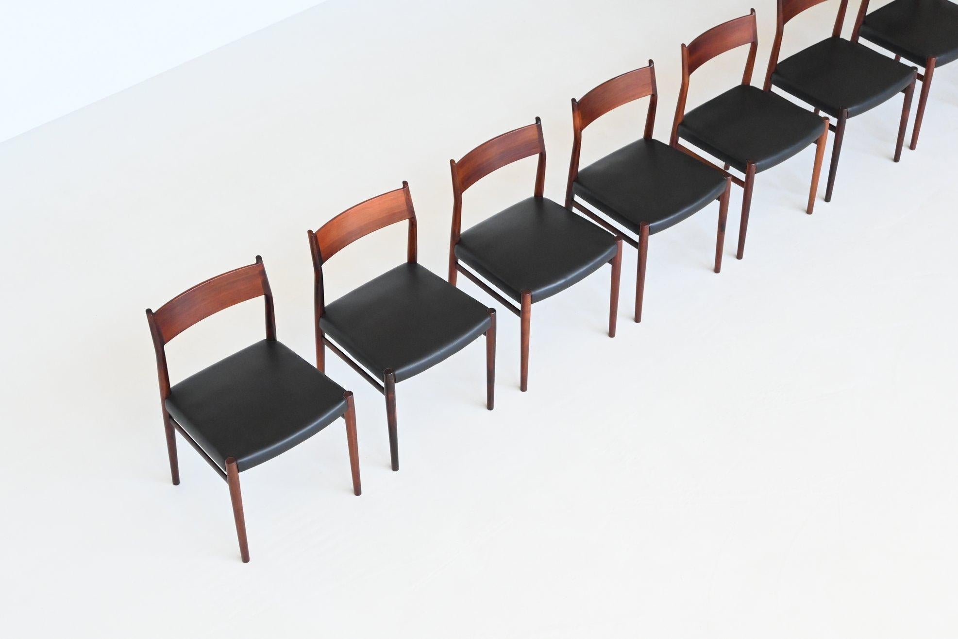Stunning set of eight beautiful shaped dining chairs model 418 designed by Arne Vodder and manufactured by Sibast Møbler, Denmark 1962. The frames are made from highly figured, exquisite Brazilian solid rosewood and the seats are covered with