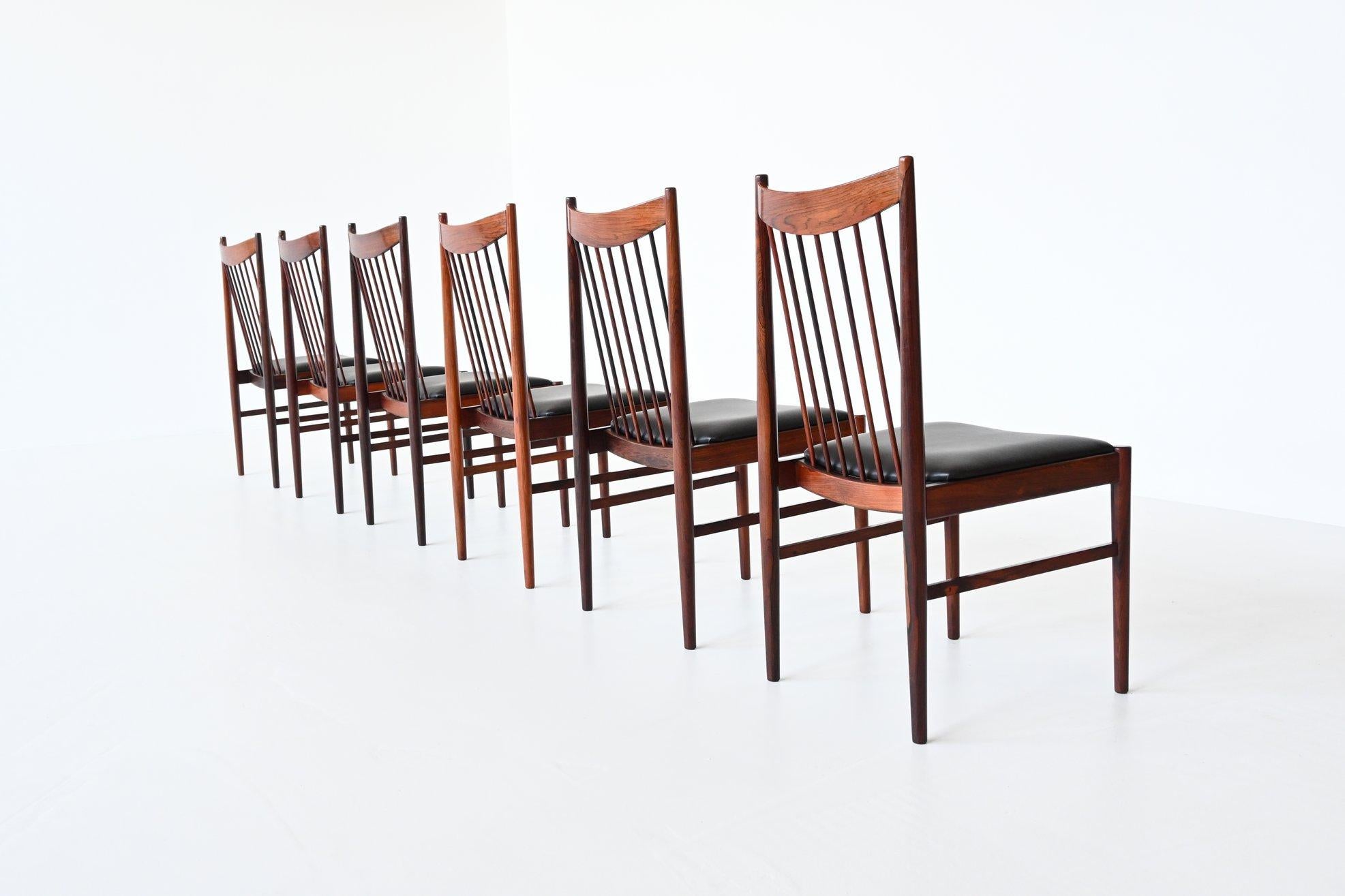 Beautiful shaped set of six dining chairs model 422 designed by Arne Vodder for Sibast Mobler, Denmark 1960. These well-crafted chairs are made of solid rosewood and the seats are newly upholstered with high quality black aniline leather. Very nice