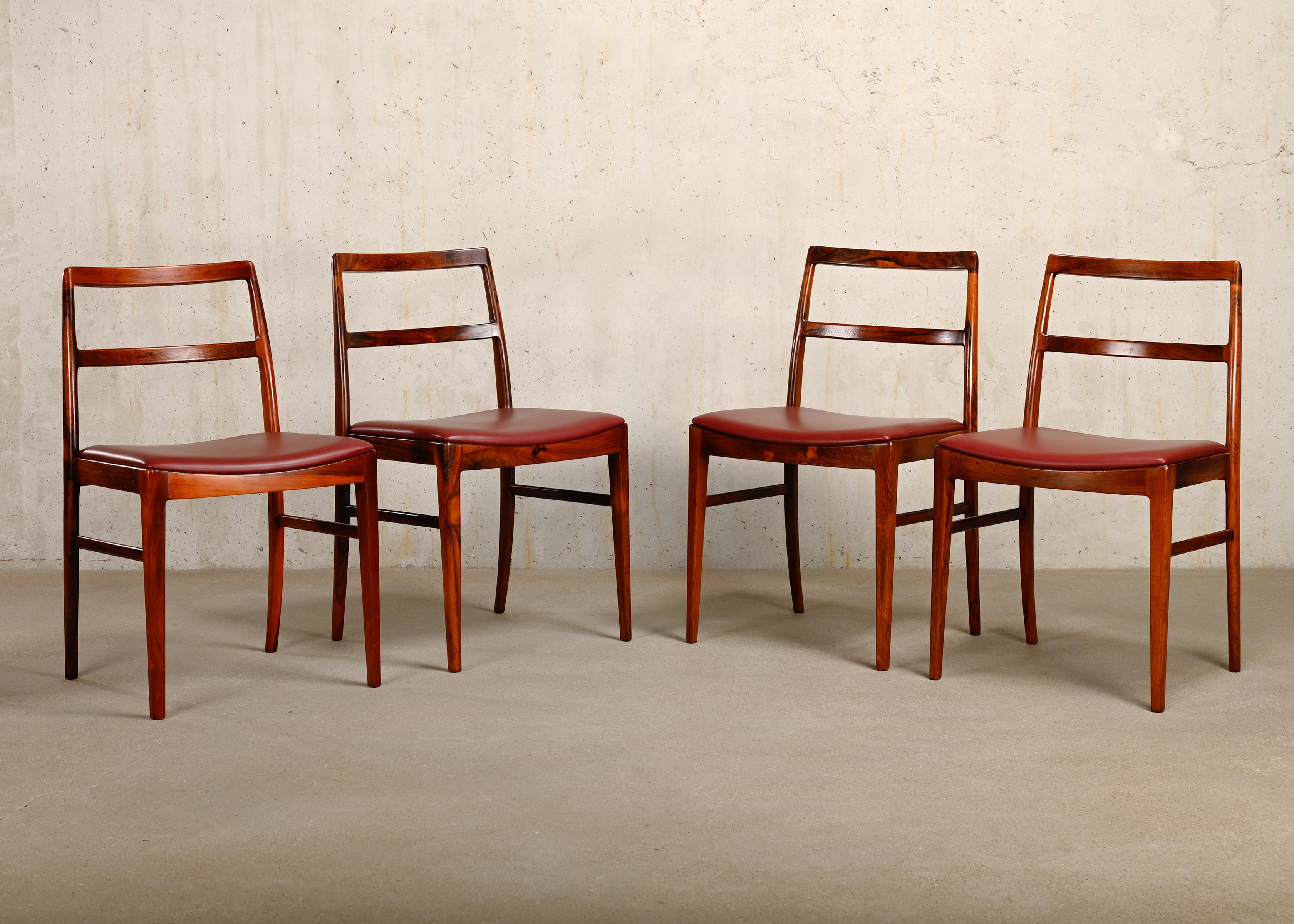 Graceful set of four dining chairs designed by Arne Vodder for Sibast Møbler, Denmark. Nicely shaped rosewood frames by hand manufactured with great craftsmanship. Very good original condition with sturdy rosewood frames and leather cushions. The