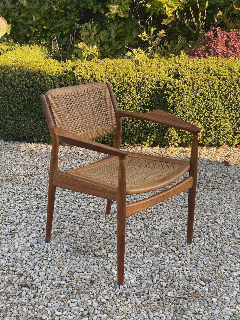 Arne Vodder Model 51A teak & rattan armchair for P Olsen Sibast Møbelfabrik 1953

Magnificent mid century Arne Vodder Model 51A teak & rattan armchair for P Olsen Sibast Møbelfabrik, Denmark circa 1953, the aggressively styled armrests and frame