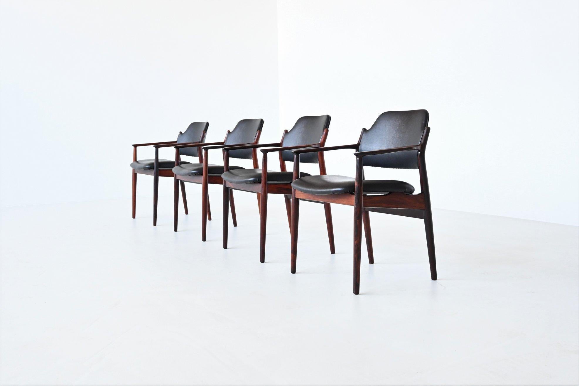 Beautiful shaped set of four armchairs model 62A designed by Arne Vodder for Sibast Møbler, Denmark 1960. The elegant frame is made of solid rosewood and the seat and back are upholstered with original black faux leather. Extremely comfortable and a