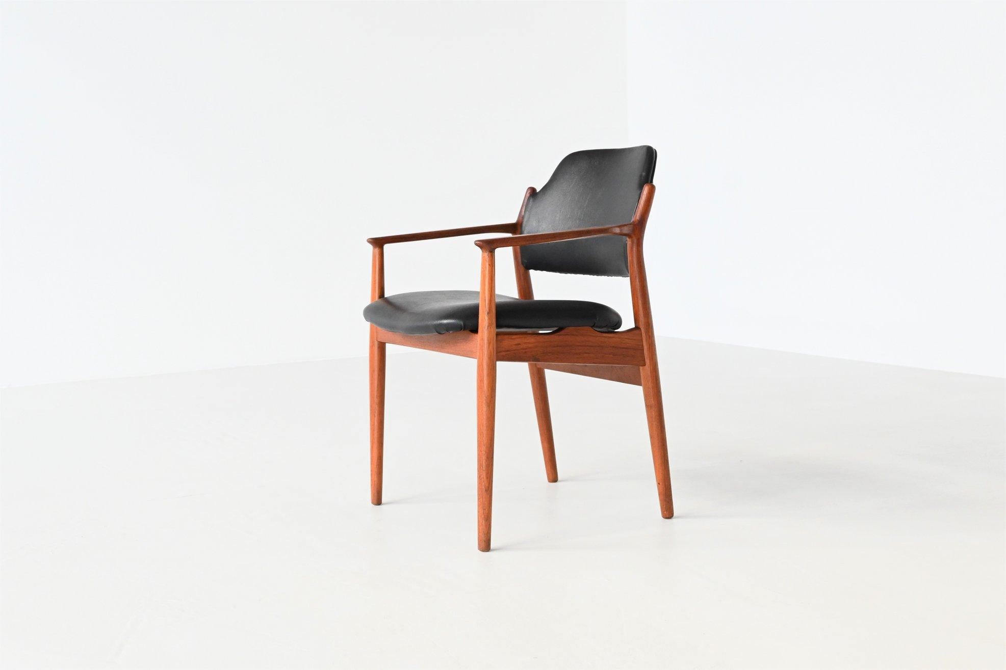 Beautiful shaped armchair or desk chair designed by Arne Vodder and manufactured by Sibast Møbler, Denmark 1960. The frame is made of solid teak wood and the seat and back are upholstered with original black faux leather. Extremely comfortable and a