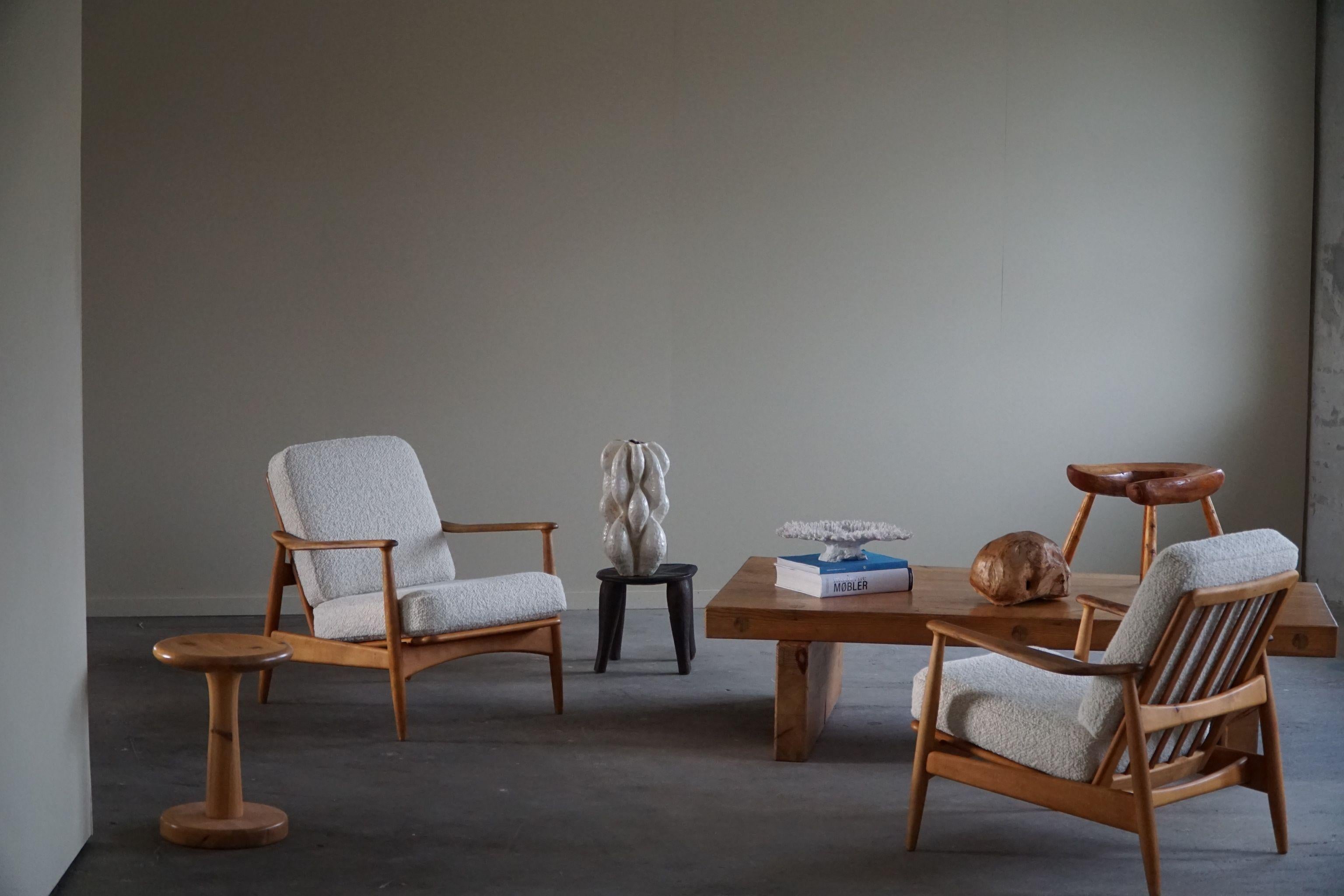 Appealing pair of lounge chairs in solid beech, armrest made in teak. Designed by Arne Vodder for France & Daverkosen in 1950s, Denmark. A classic design that will complement many interior styles. A modern, Scandinavian or an Art Deco home decor.