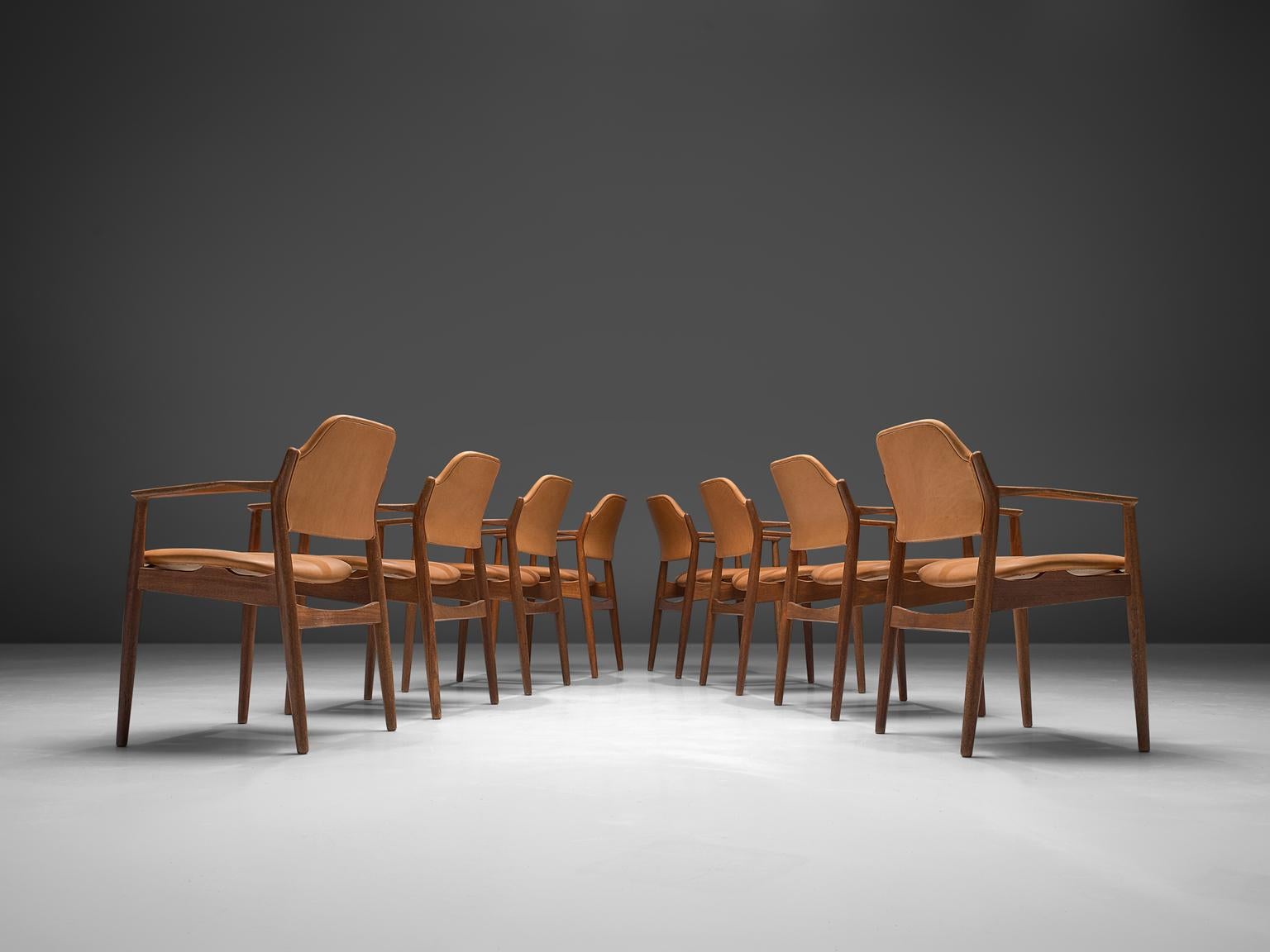 Arne Vodder for Sibast, set of 8 reupholstered dining chairs model 62A, rosewood and cognac leather, Denmark, 1960s.

This classic set of eight chairs is executed in leather and rosewood and designed by the Danish designer Arne Vodder. These