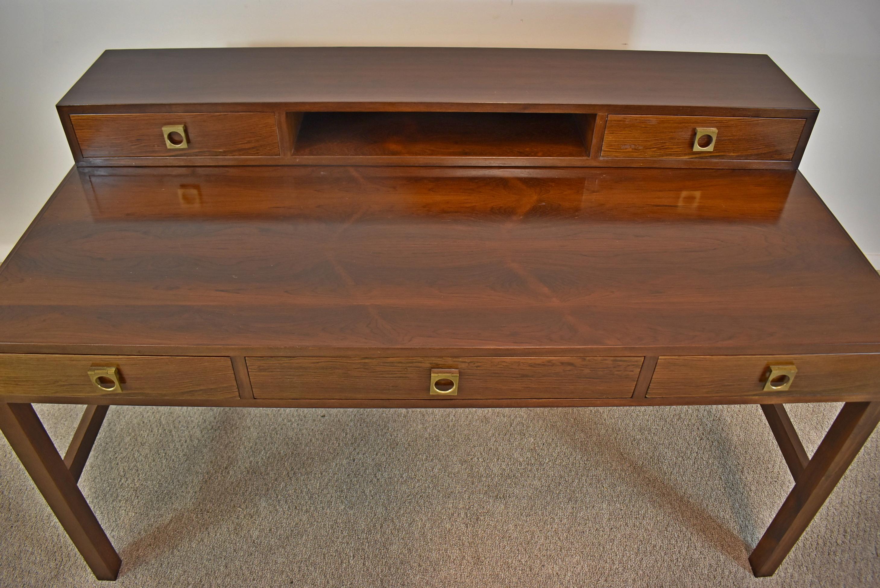 Arne Vodder rosewood desk. circa 1960s. Rosewood writing desk with a hinged fliptop to convert the desk into a partner's desk. Dovetailed drawers and brass hardware in Vodder style. Great condition, some wear consistent with usage and age.