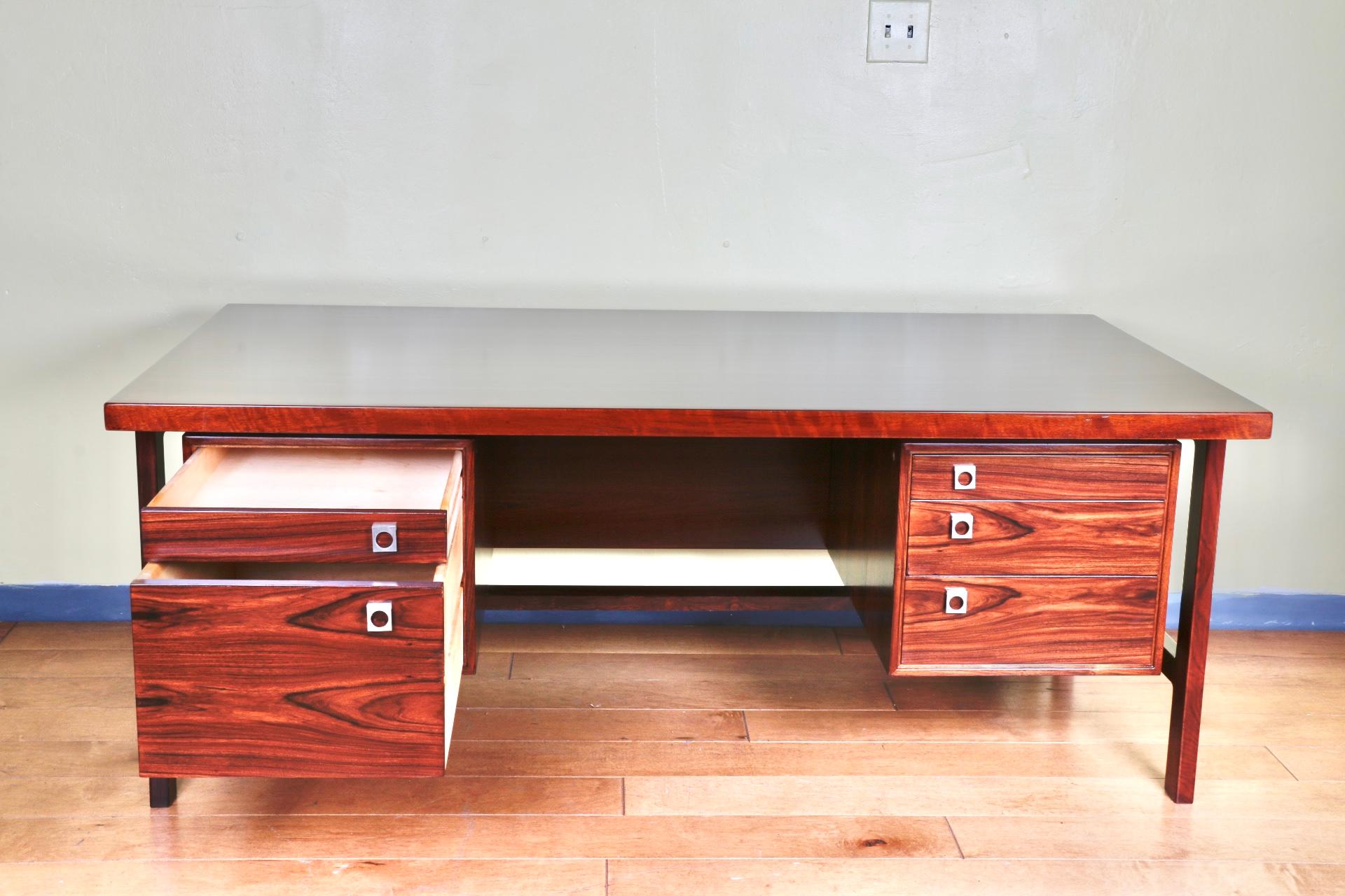 Gorgeous Rosewood executive desk in good refinished condition. Very strong and sturdy. Beautiful detailed grain. All drawers slide perfectly and work well. Great for any home or office. Great design and brand.