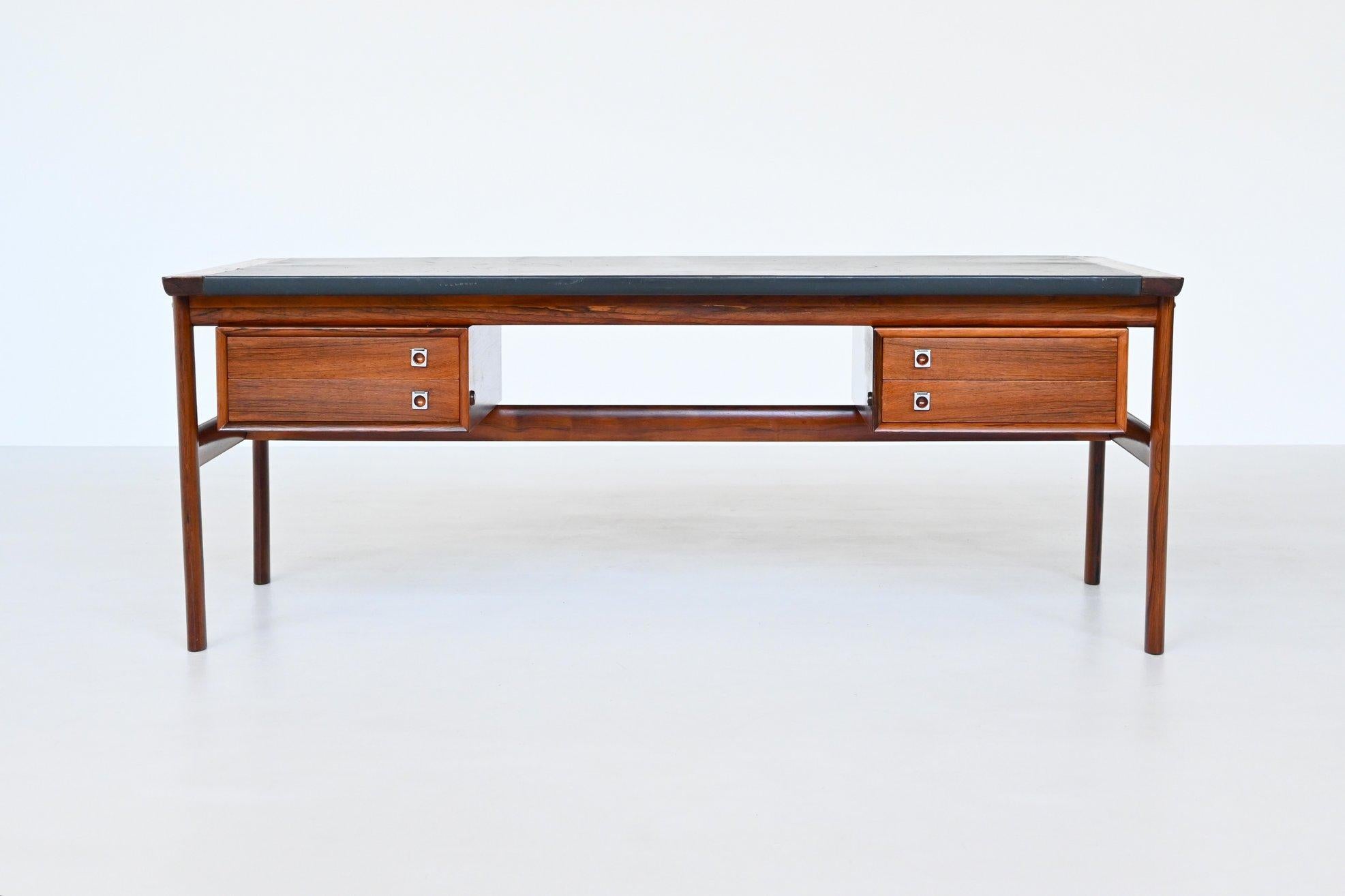 Iconic executive desk from the “200 series” designed by Arne Vodder; one of the best designers Denmark has known and it is manufactured by Sibast Furniture, Denmark 1960. This luxurious desk features a lot of storage space and shows wonderful