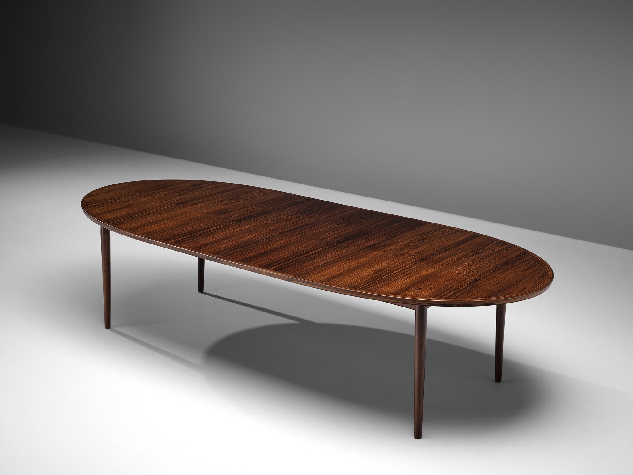 Dining table in rosewood by Arne Vodder for Sibast, Denmark, 1950s.

Large oval table in rosewood design by Arne Vodder. This extendable table comes with two leaves, which give it an extra length of one meter. The design is modest and allows the