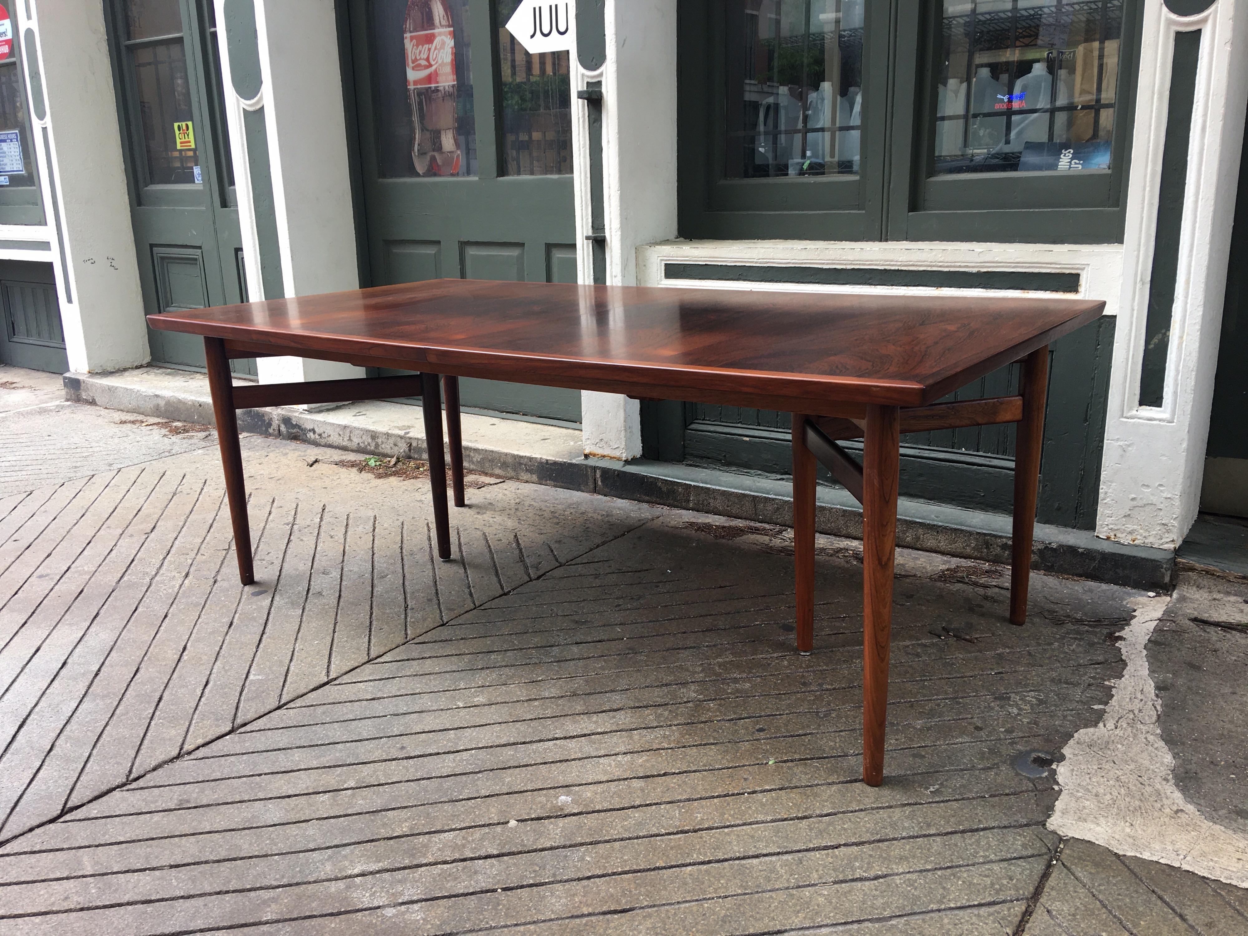 Arne Vodder for P. Olsen Sibast rosewood extension table. Table includes 2 large leaves that easily store inside the table, each leaf is 19.5 wide. When fully extended table is 117.5 long. Table when closed seats 8 comfortably! Beautiful leg design
