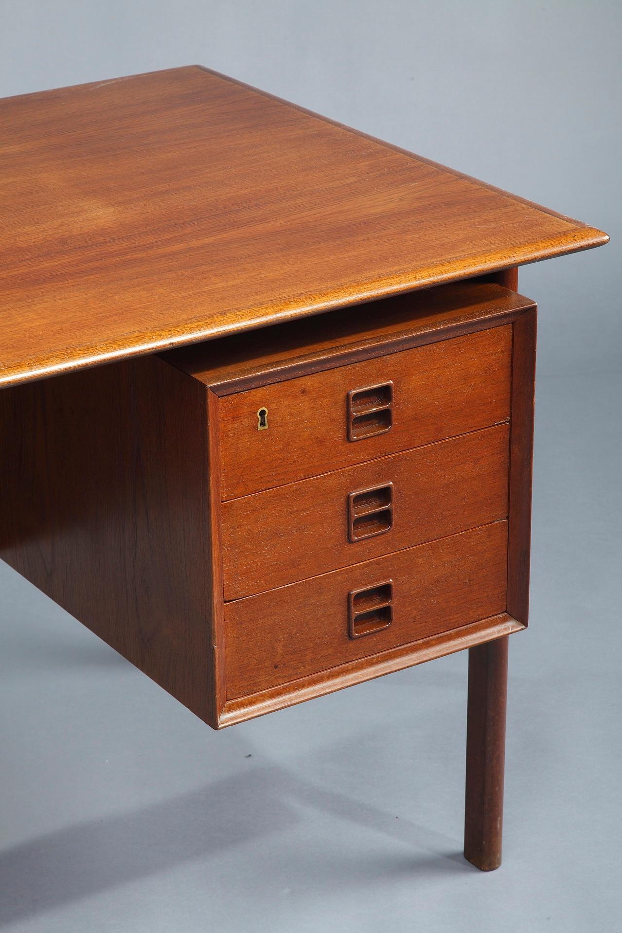 Scandinavian desk crafted in rosewood. It has 6 drawers and 3 large, open bookshelves in the back. Original key included. Designed by Arne Vodder (1926-2009), Denmark. Manufactured by Sibast. The piece is representative for the Danish