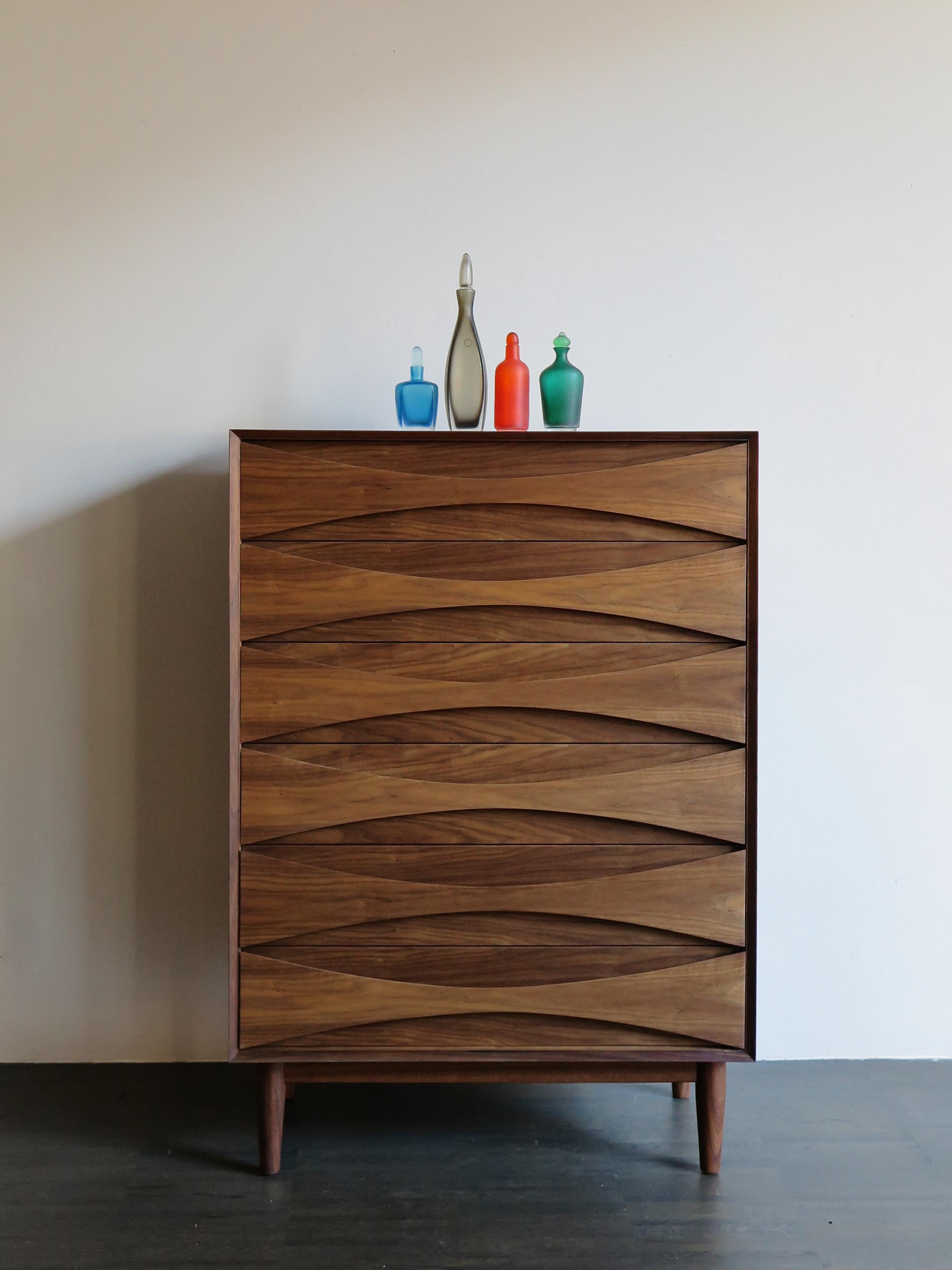 Scandinavian walnut chest of drawers designed by Danish artist Arne Vodder from 1950.