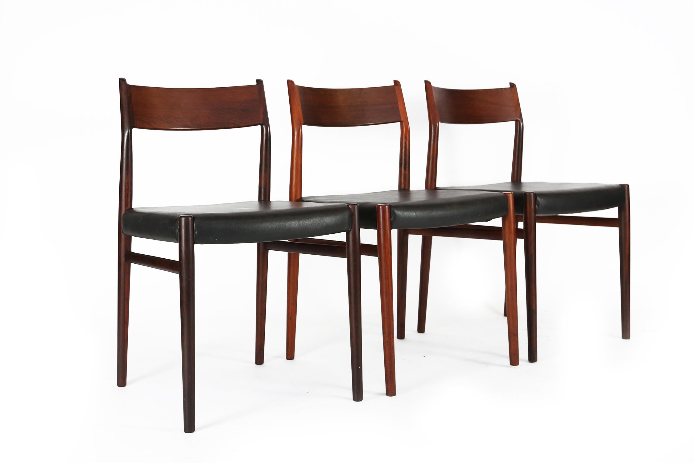 Very nice set of 8 dining chairs model 418 designed by Arne Vodder for Sibast Mobler, Denmark 1965, 6 chairs and 2 armchairs or carvers. 
These chairs are made of solid rosewood and original upholstery in very good condition. The chairs are very