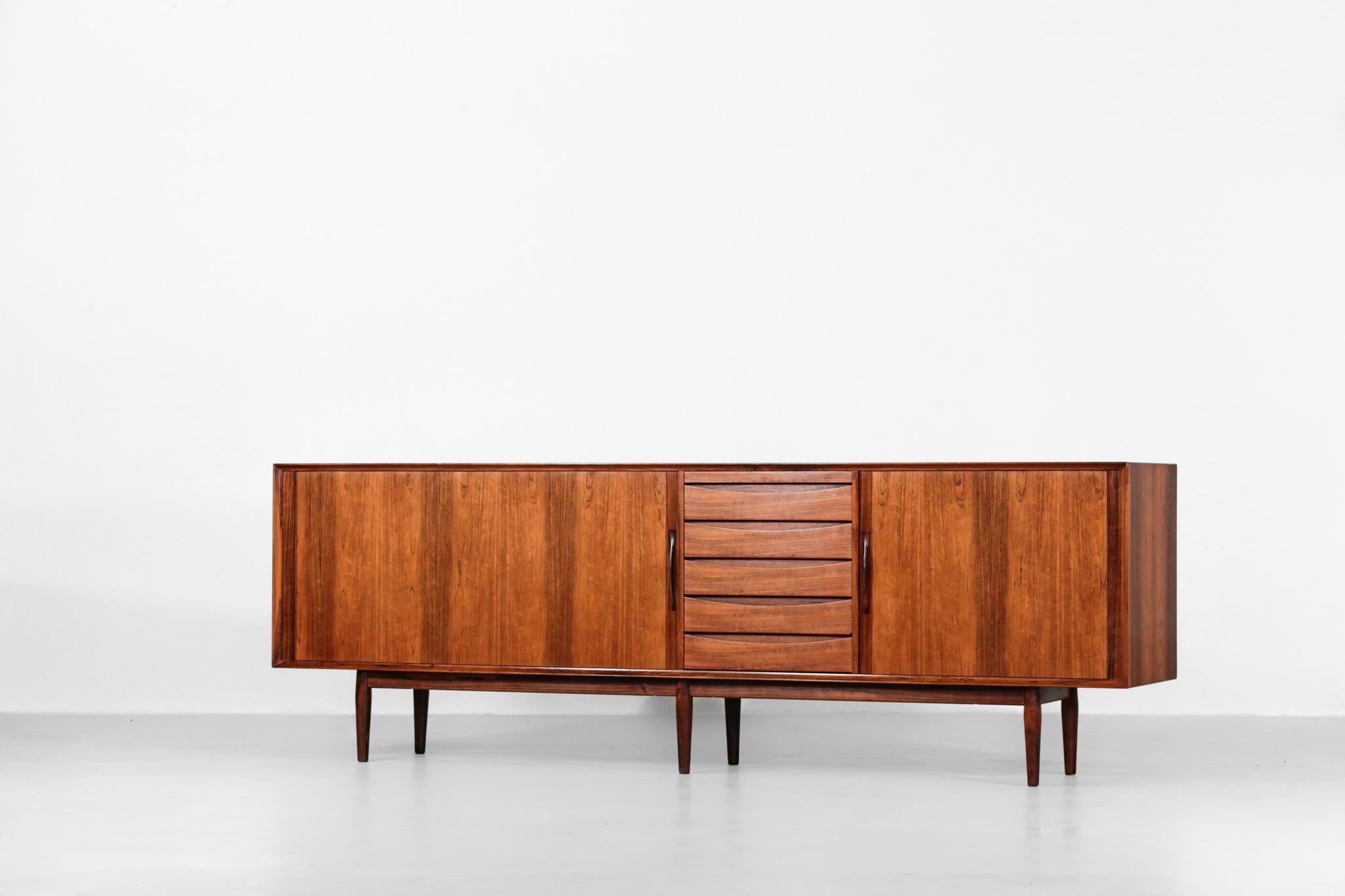 Large sideboard designed by Arne Vodder.
Rare model in rosewood.
Composed of 5 drawers with 2 sliding doors on each side.
 