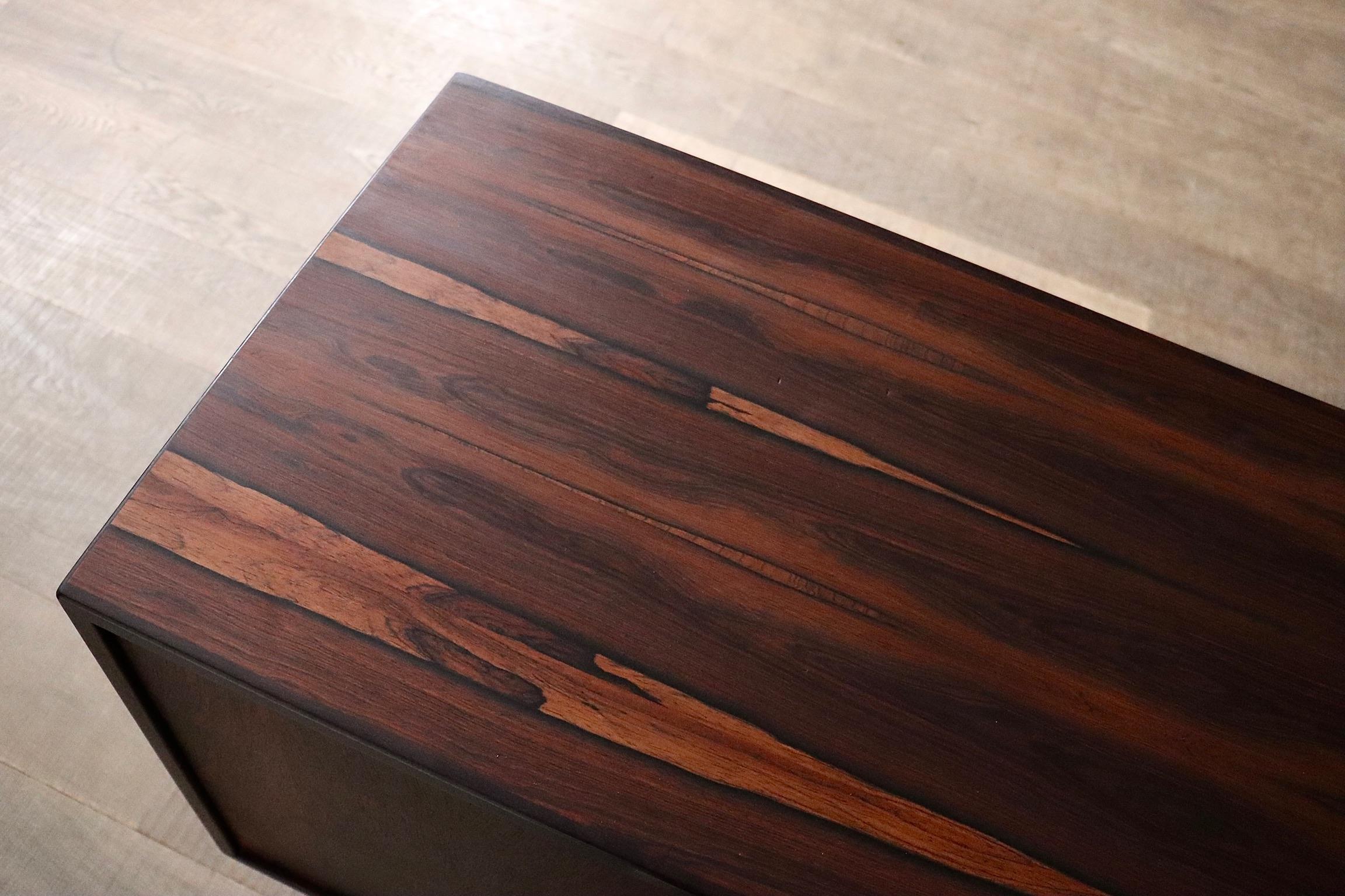 Beautiful Model 37 sideboard designed by Arne Vodder and produced by Sibast Møbler, Denmark, 1960s. Crafted from rich rosewood, the cabinet shows a striking grain pattern that highlights the natural beauty of the material.

The design is defined by