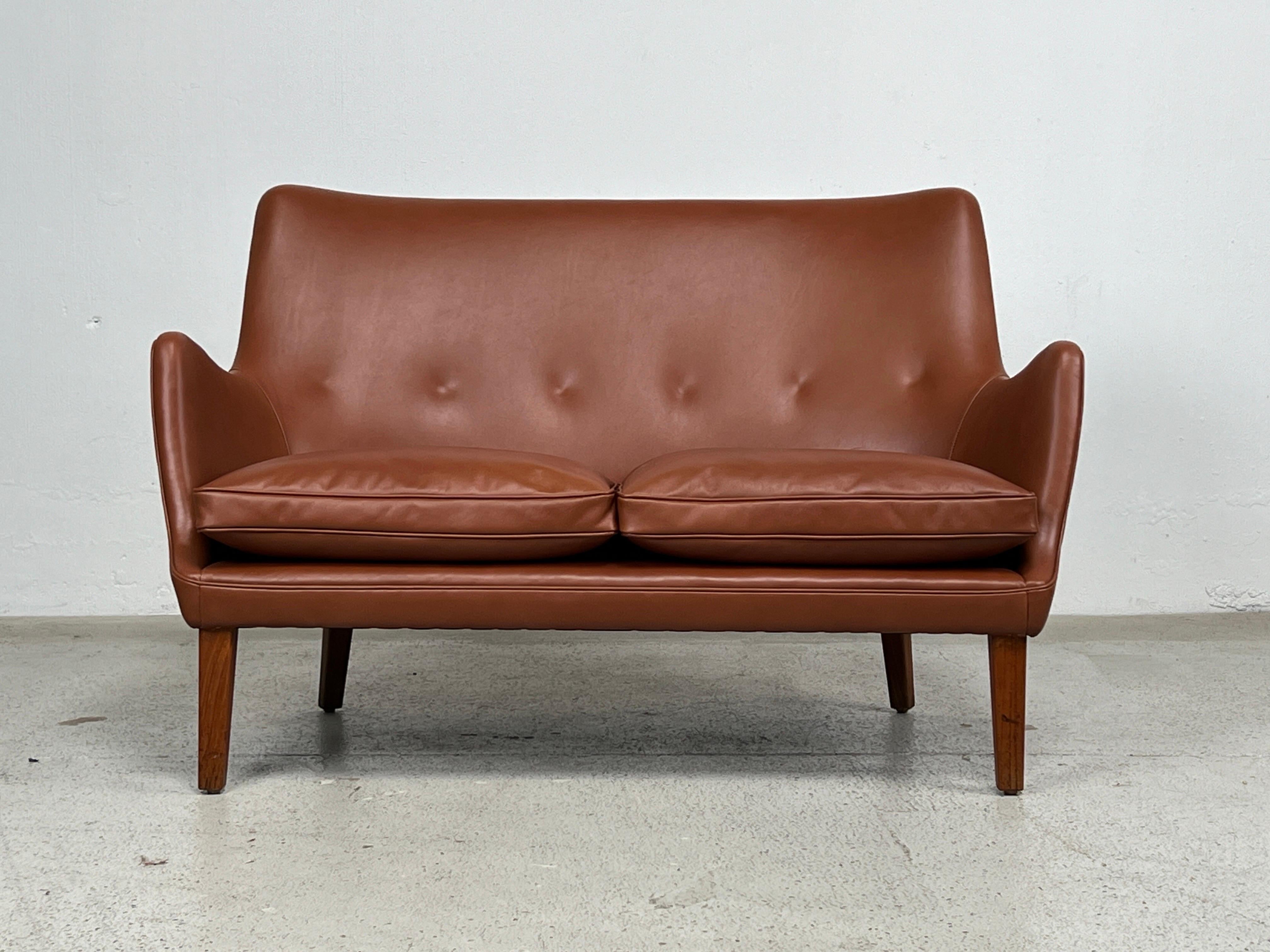 Arne Vodder two seater settee sofa for Ivan Schlechter. Perfectly restored in leather with down cushions. 
