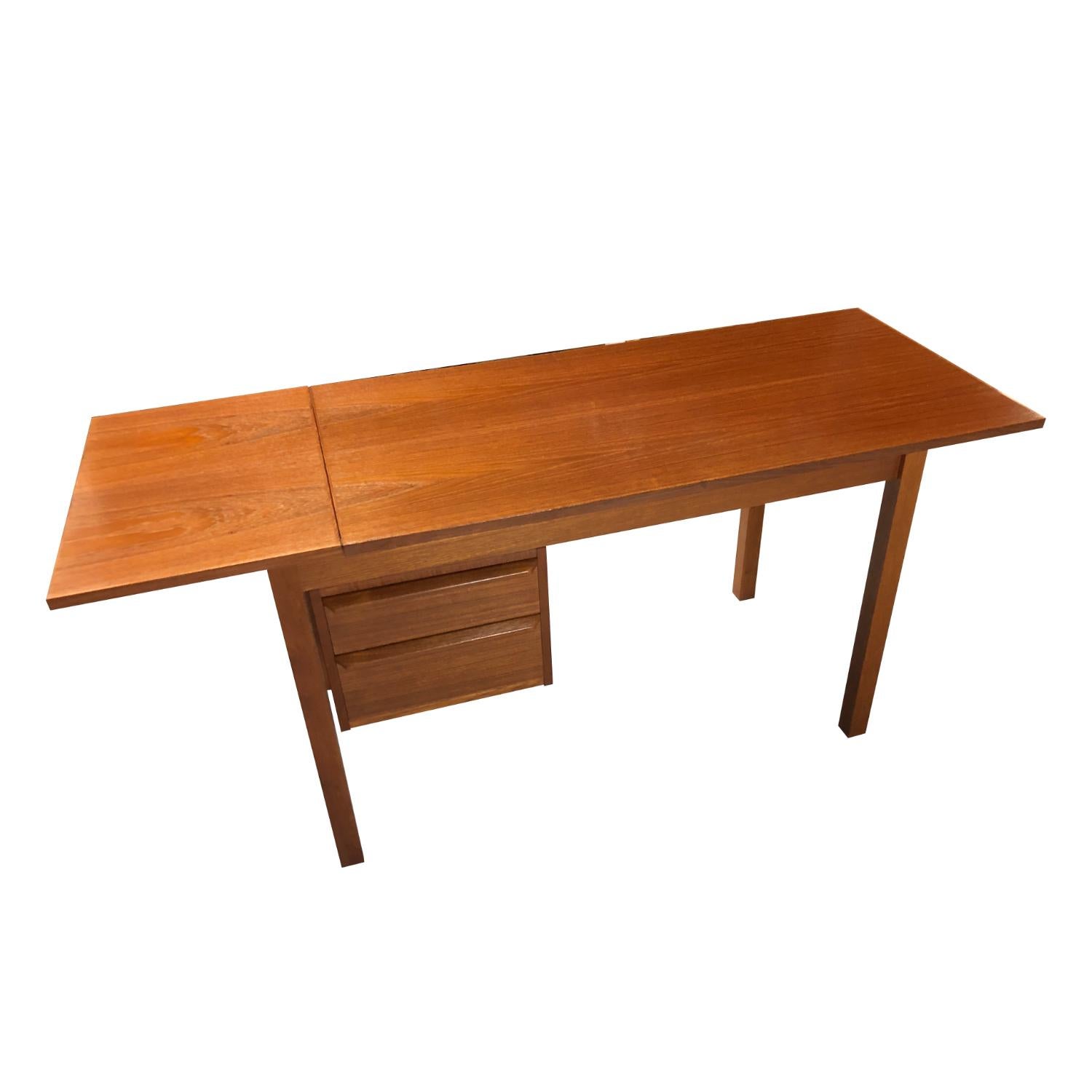 This expanding Danish teak desk by G.V. Mobler provides a ton of functionality in a compact package. The table top and the drawers are adjustable! Lift the drop-leaf and slide the table top to center it over the legs. The leaf extension lengthens