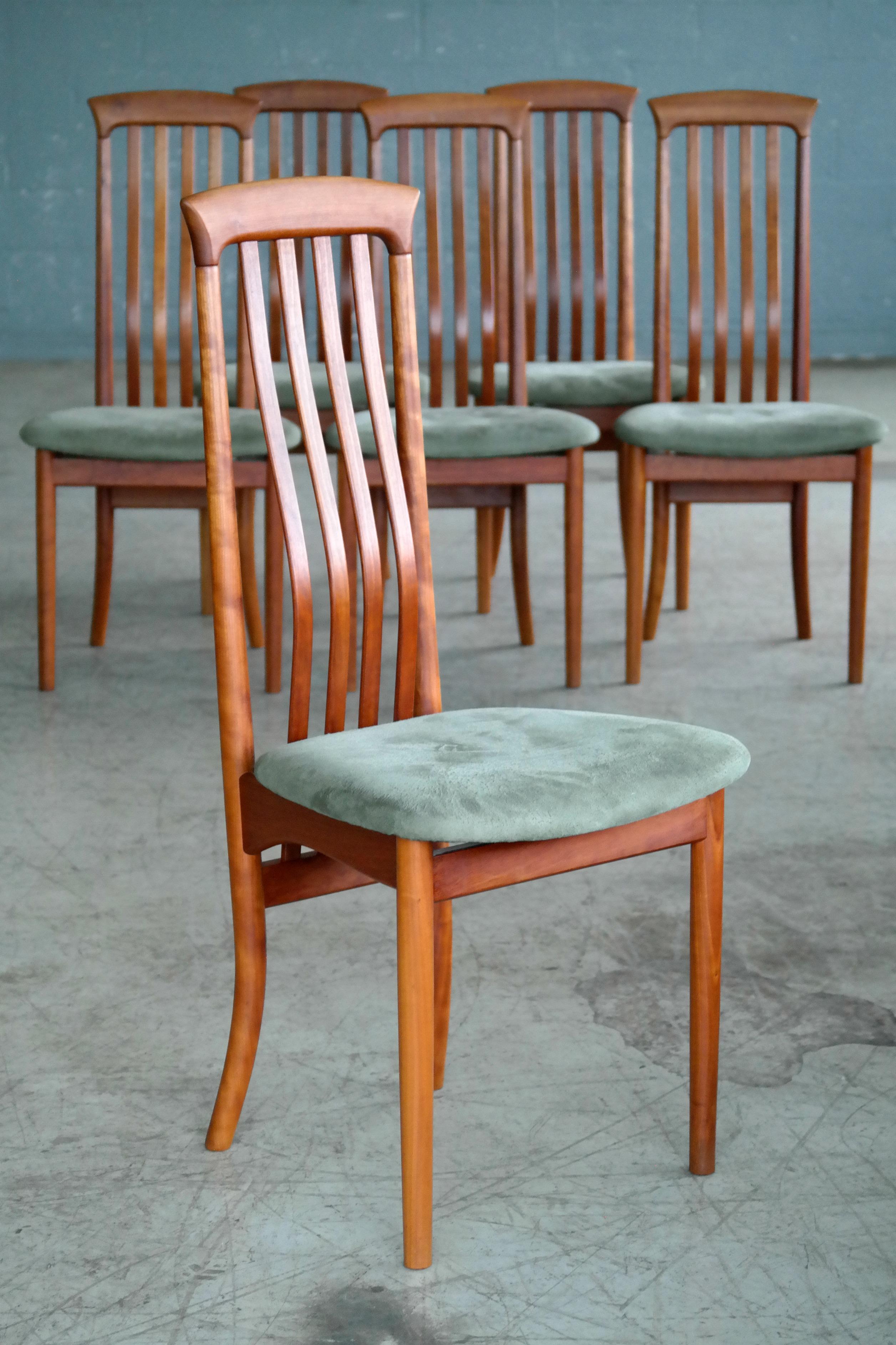 Stunning Arne Vodder style set of six highback dining chairs by Sibast Mobler. Similar in style to Niels Koefoed's Eva dining chair these chairs are labeled by Sibast one of Denmark's premier furniture makers and a producer for Arne Vodder and other
