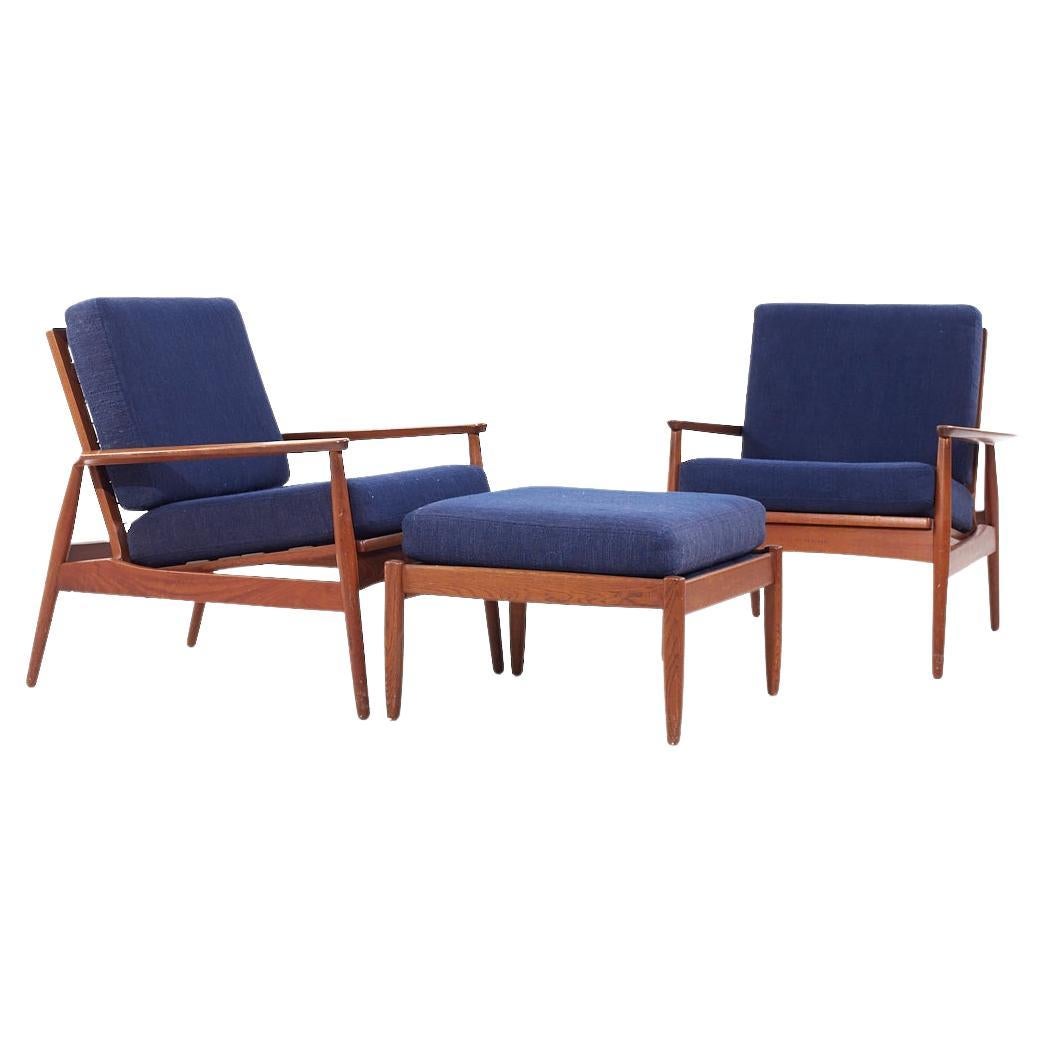 Arne Vodder Style Mid Century Danish Teak Lounge Chairs and Ottoman - Pair

The chair measures: 29 wide x 30.5 deep x 30.5 high, with a seat height of 17.5 inches and arm height/chair clearance of 20.5 inches
The ottoman measures: 23 wide x 23 deep