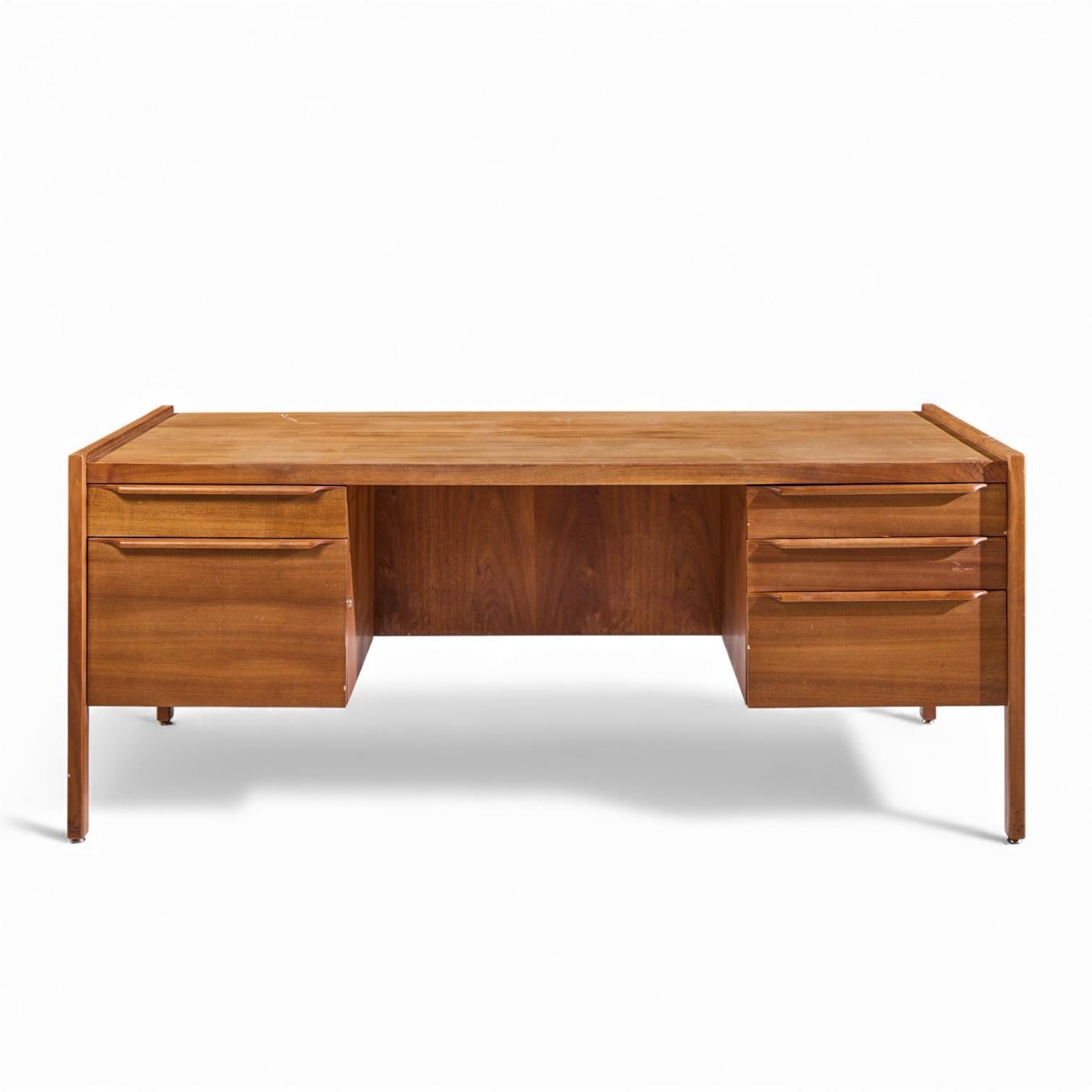 Arne Vodder Style Mid Century Teak Executive Desk

This desk measures: 72 wide x 37.25 deep x 28.75 high, with a chair clearance of 27 inches

Good Vintage Condition - Minor Area of Stain Wear Throughout. Scratches on Desk Top Surface and Minor