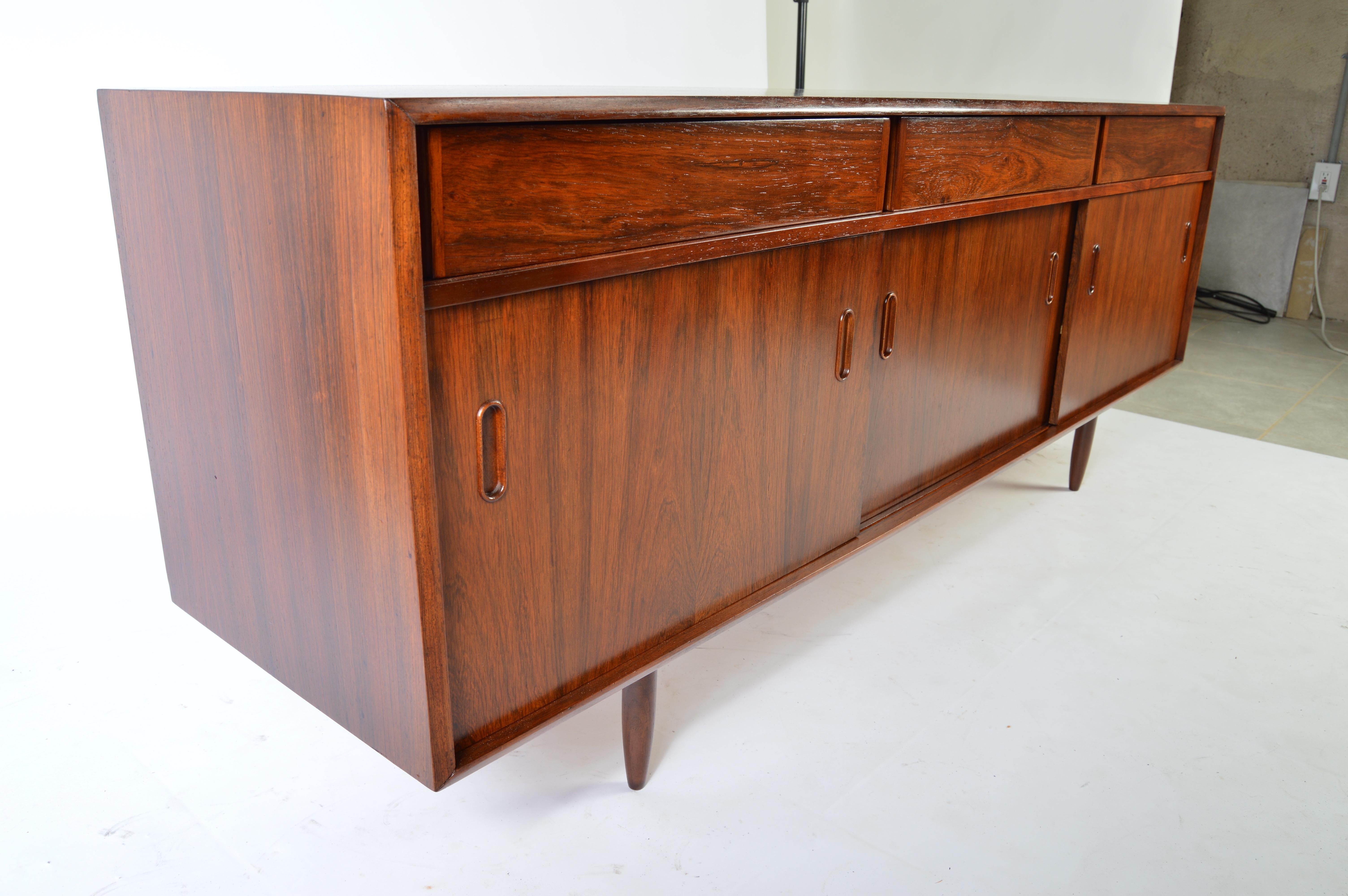 A beautiful Brazilian rosewood credenza in the manner of Arne Vodder.