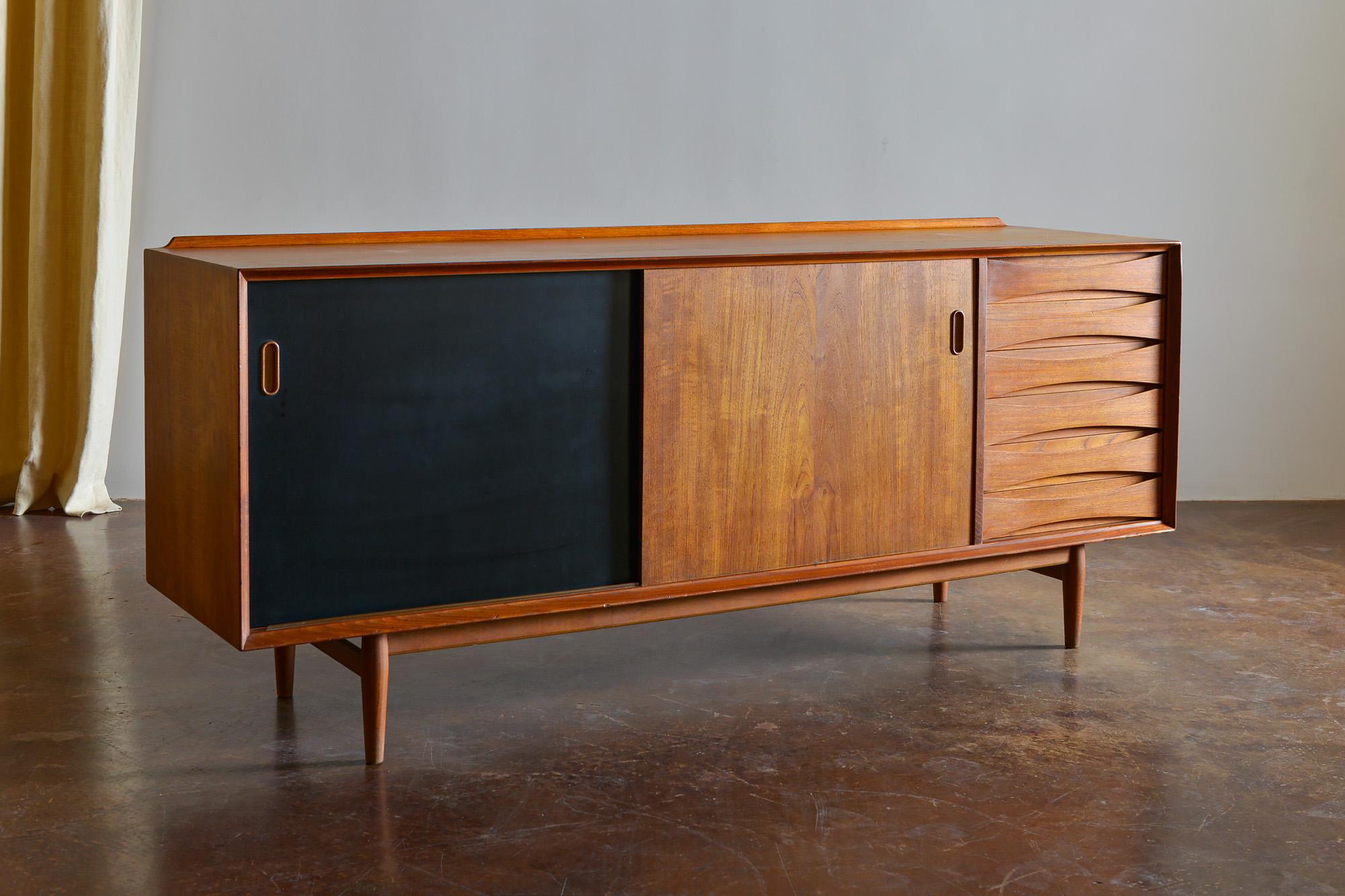 Arne Vodder teak credenza for Sibast Mobler, Denmark, 1960s. Sliding doors are reversible to black lacquer.