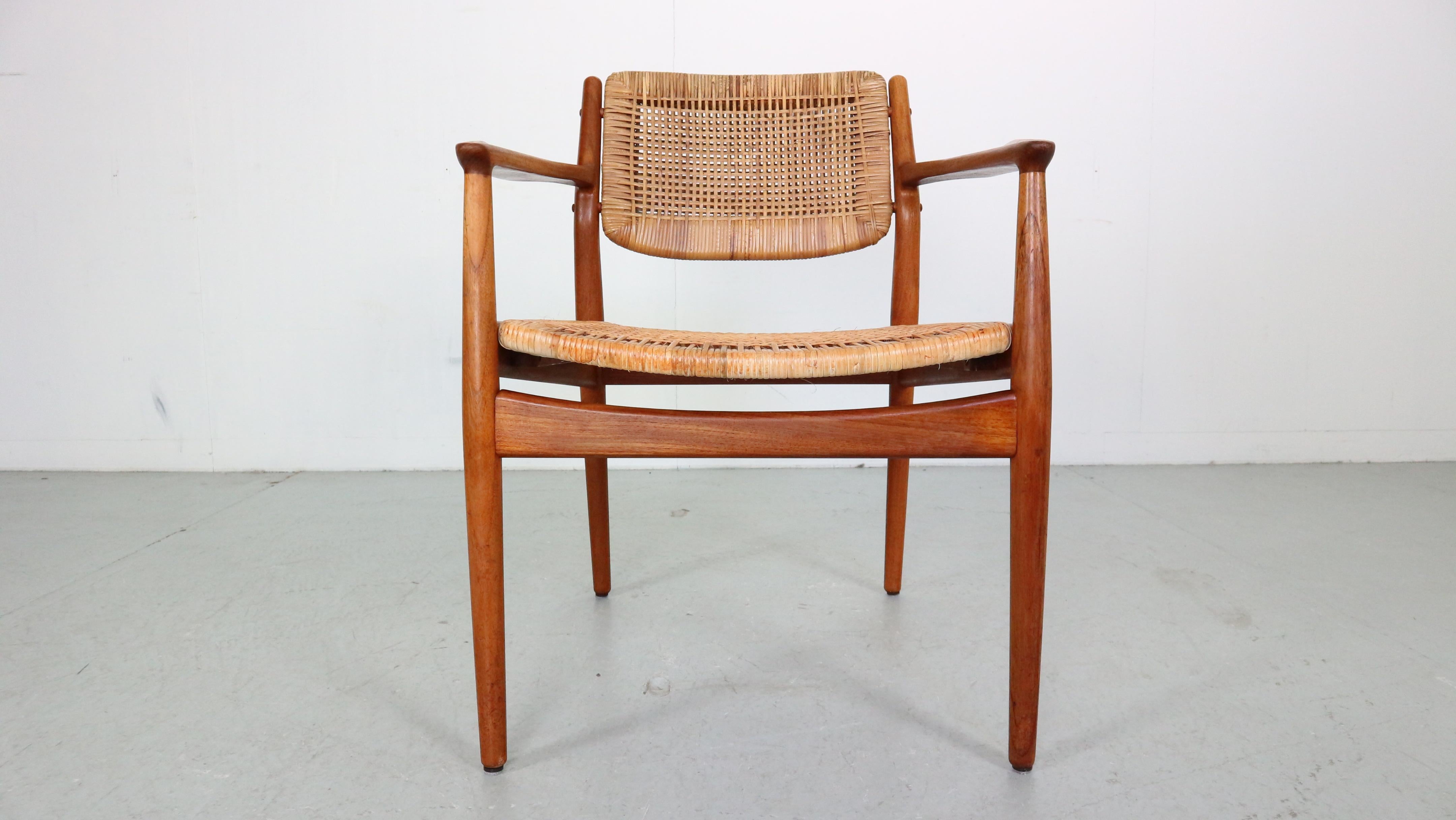 Rare vintage Danish design teak/rattan chair designed by Arne Vodder for Sibast Furniture in the 1950s. Arne Vodder was trained by Finn Juhl and eventually became his business partner. He studied under Juhl at the Royal Danish Academy of Fine Arts
