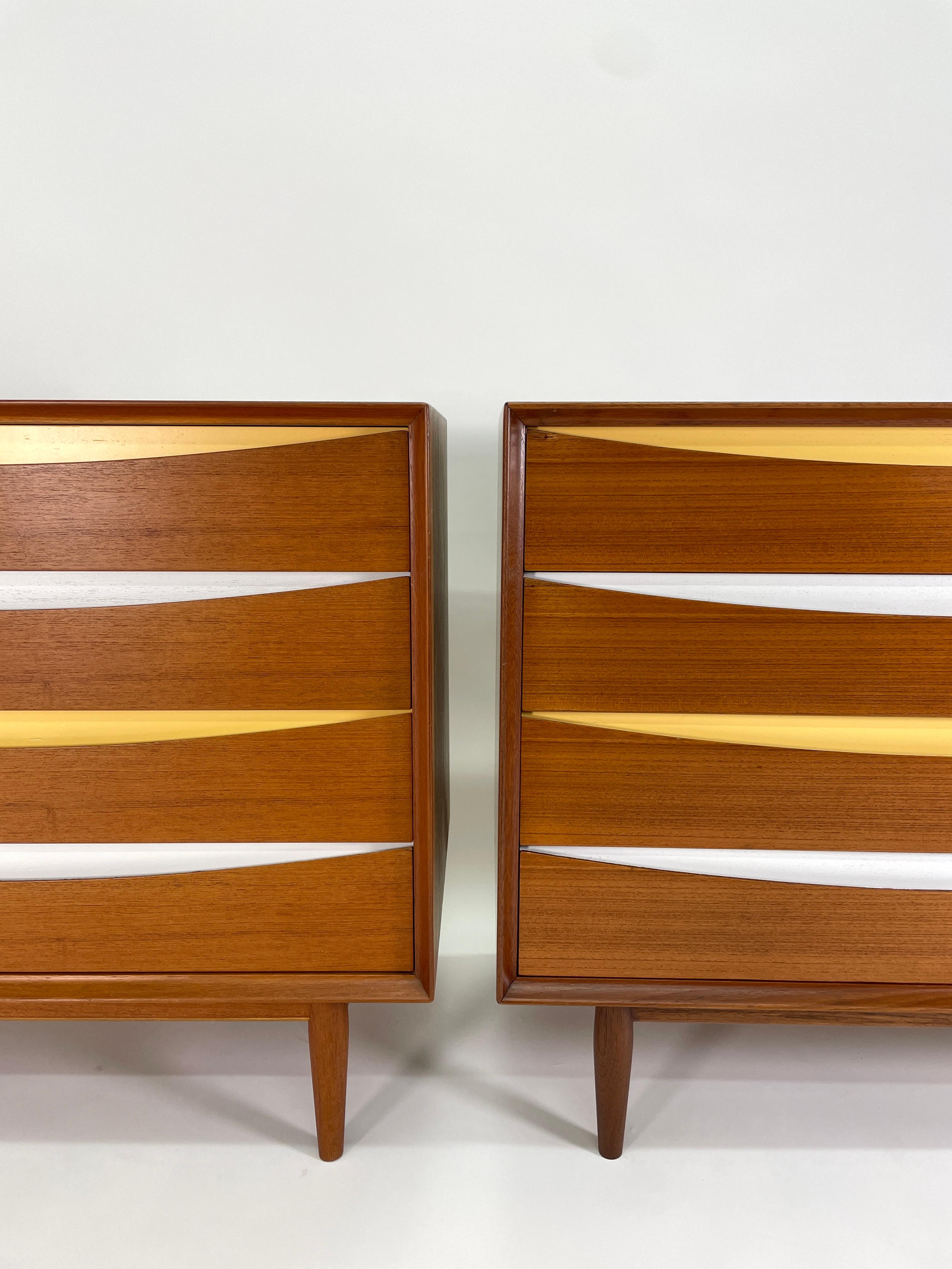 An iconic design by Arne Vodder Triennale 4-drawer dresser was produced by Sibast Mobler, circa 1950. Constructed in teak, the 4-drawer dresser is a classic piece of Danish Modern furniture. The drawers are alternating yellow and white. The drawer