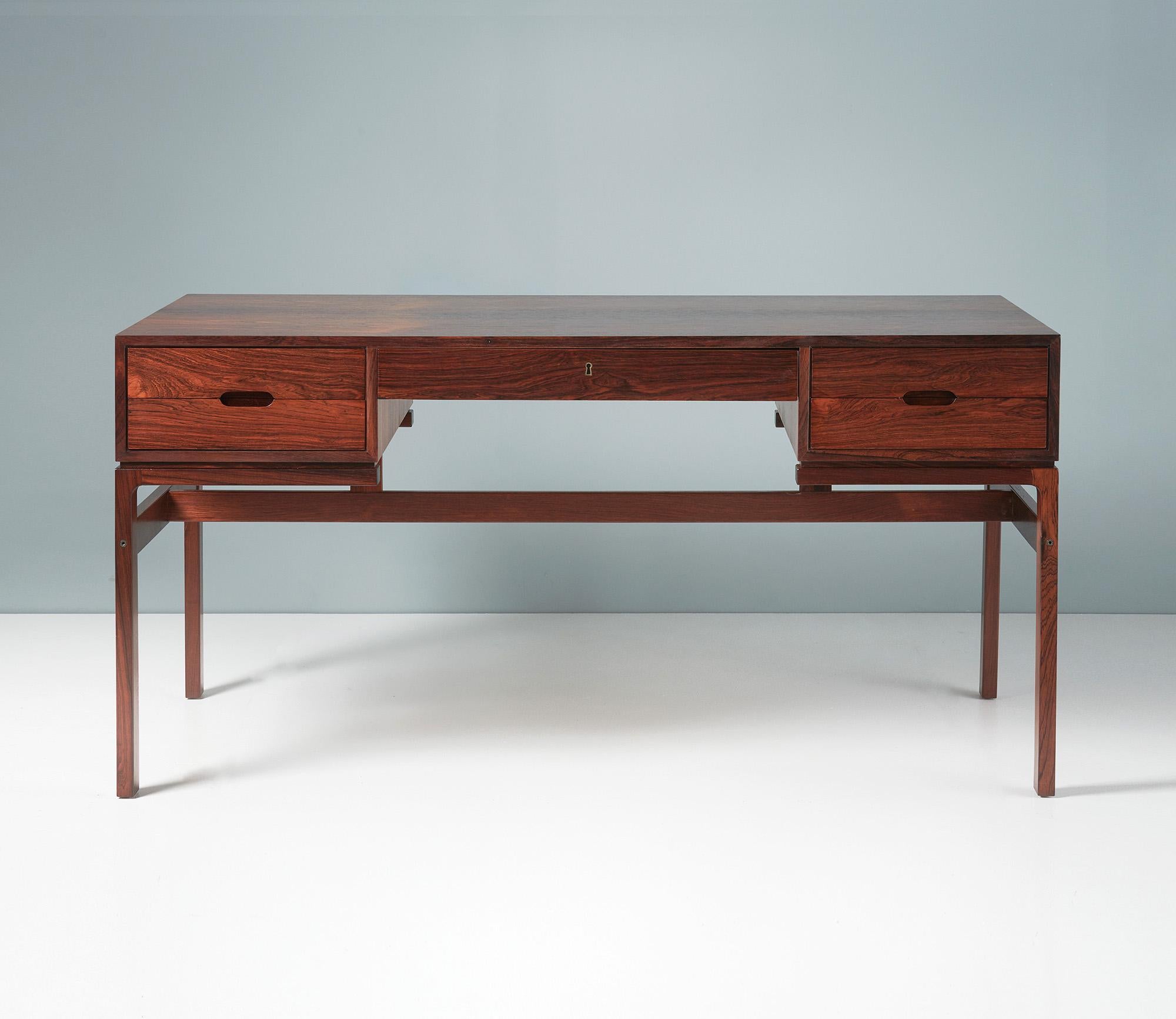 Arne Wahl Iversen Desk

This beautiful and compact desk was designed by Arne Wahl Iversen in the early 1960s and produced by Vinde Mobelfanbrik.  The desk has 5 oak-lined drawers providing excellent storage and stunning refinished rosewood