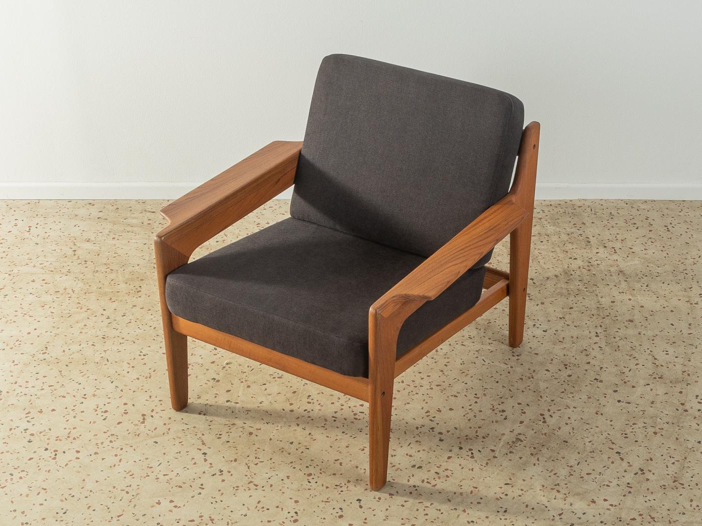 Classic armchair in teak from the 1960s by Arne Wahl Iversen for Komfort. The armchair has been reupholstered and covered with a high-quality fabric in black.

Quality Features:
 accomplished design: perfect proportions and visible attention to