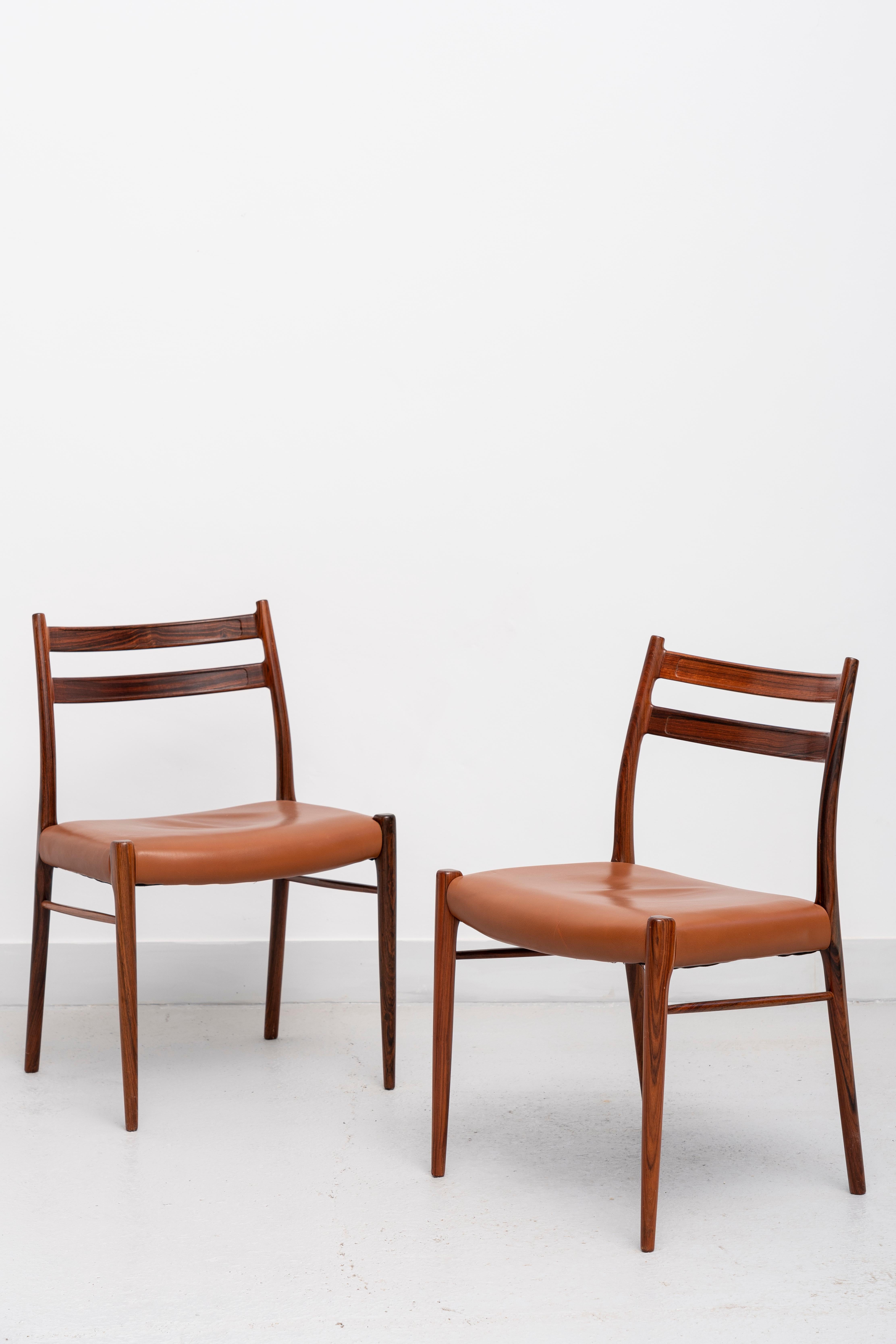 Set consists of eight dining chairs with rosewood structure lined in the seats. The origin of this chair model belongs to the design made by Arne Wahl Iversen for Glyngore Stolefabrik, in 1959. Iversen's career took off in the 1950s and his