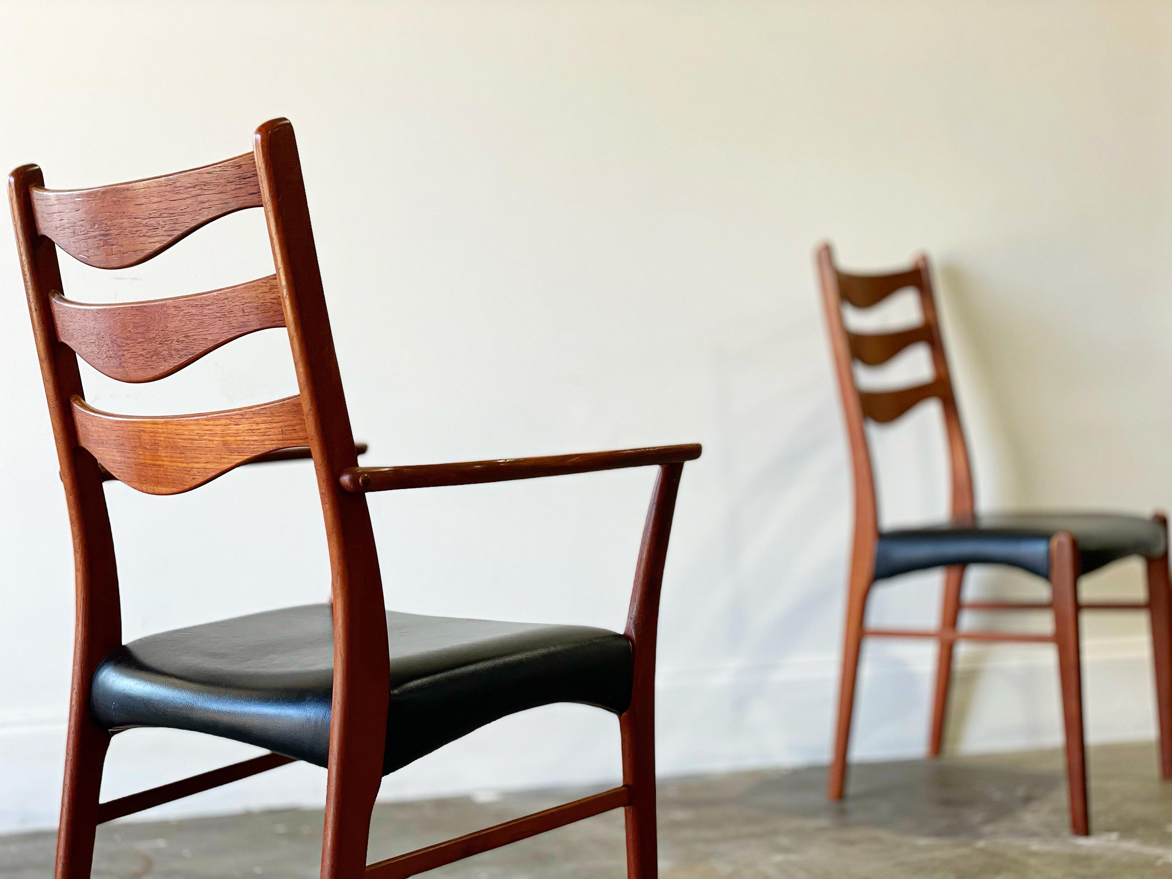 Arne Wahl Iversen for Glyngøre Stolefabrik ladder back dining chairs in teak. 
Set of eight (8)
6 side chairs - 2 arm captains chairs
Solid sculpted teak + black naugahyde

Attended to by our team of in-house craftspeople - the frames have been
