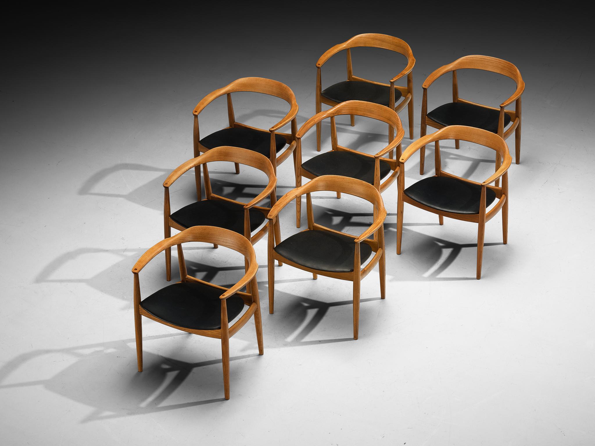 Arne Wahl Iversen for Niels Eilersen, set of eight dining chairs, ash, faux leather, Denmark, 1950s/60s 

These armchairs are representative of Scandinavian modern design, characterized by simplicity, functionality, and high-quality craftsmanship.