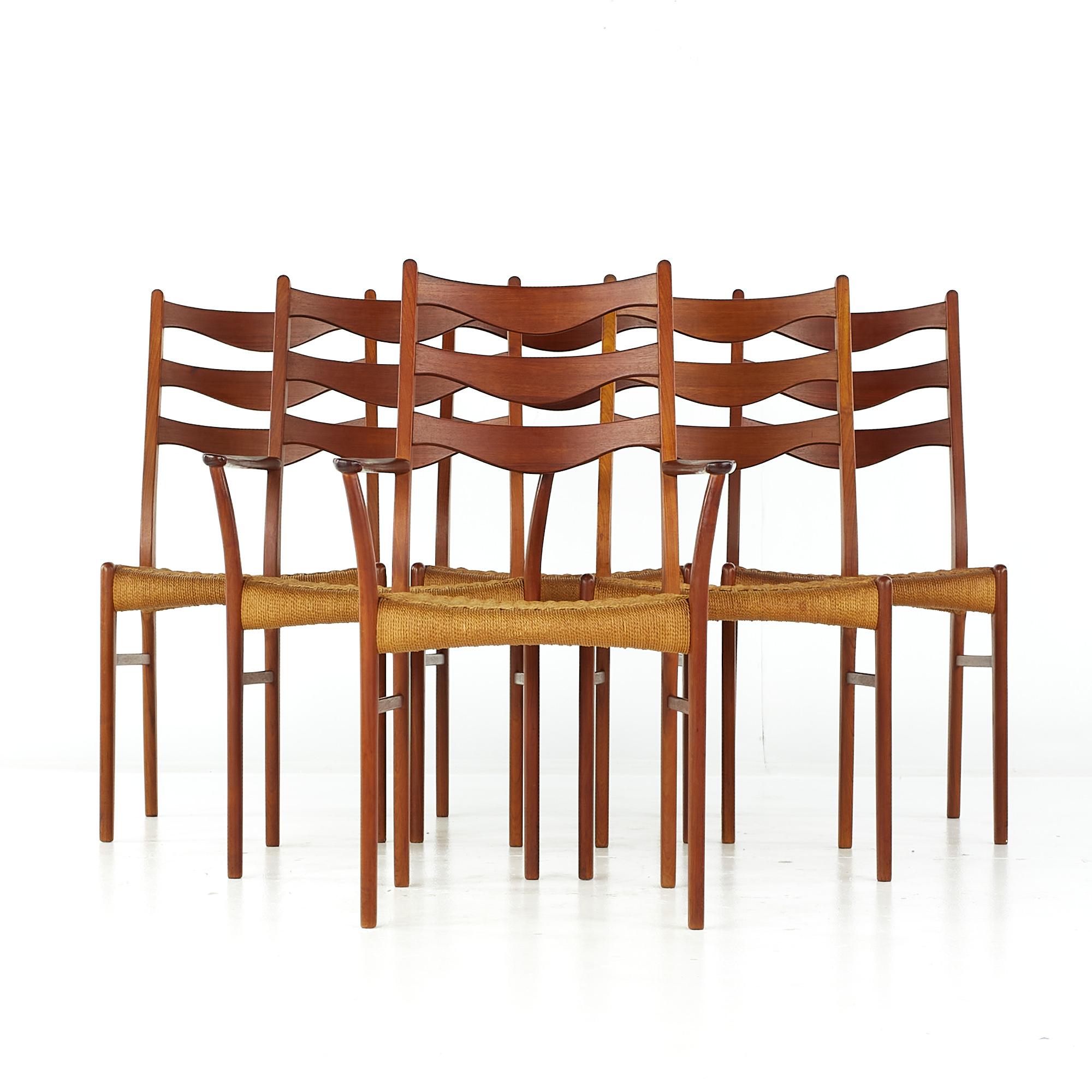 Arne Wahl Iversen GS90 mid century danish teak dining chairs with rope seats - set of 6

Each armless chair measures: 18.5 wide x 17 deep x 37 high, with a seat height of 17.25 inches
Each captains chair measures: 22.25 wide x 17 deep x 37 high,