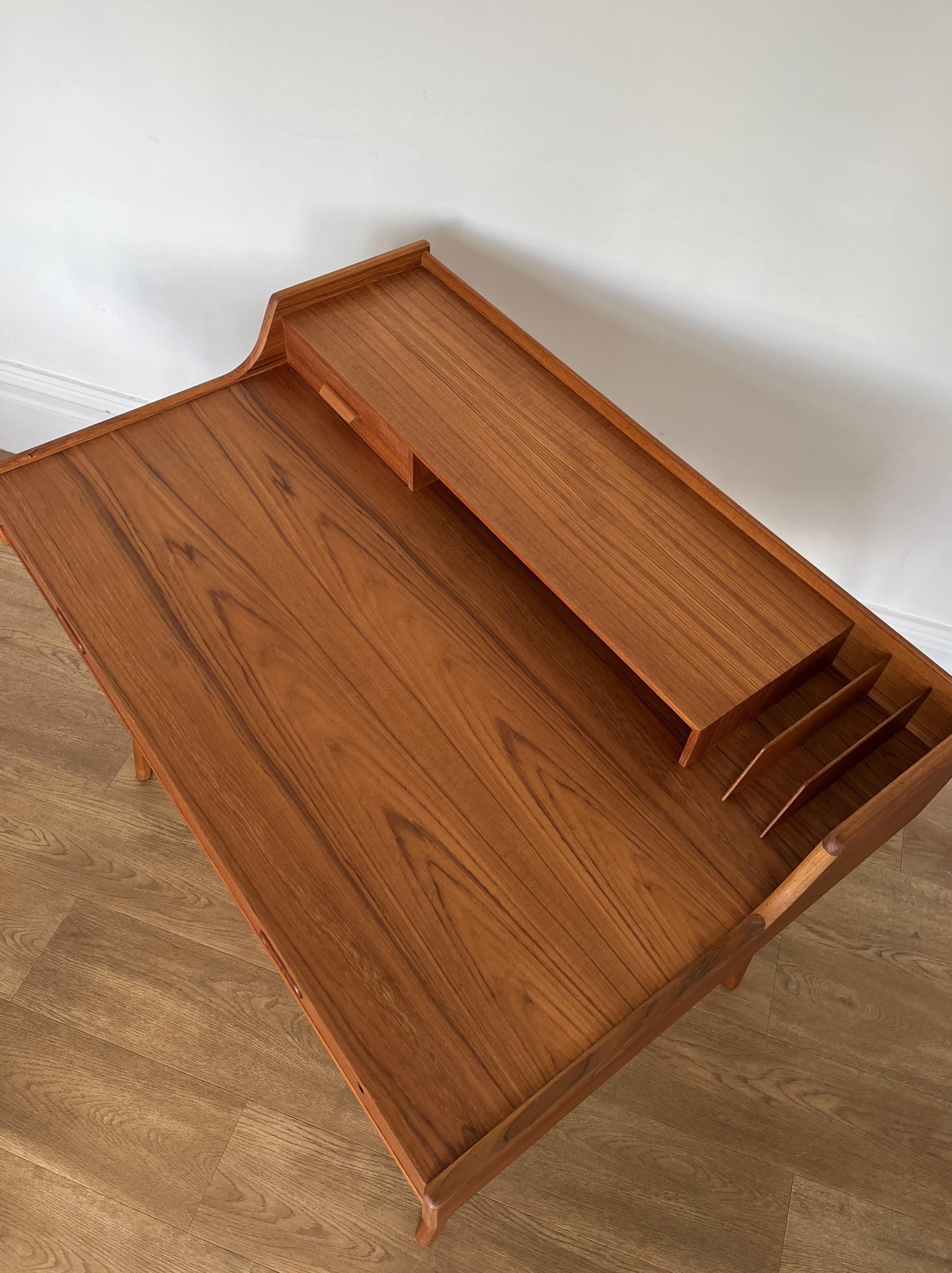 Teak, Model 56 Arne Wahl Iversen desk for Vinde Mobelfabrik.

Superb, nicely proportioned little desk with great detailing.

The desk is also finished to the rear so can stand freely in any space.

The desk has been professionally restored and