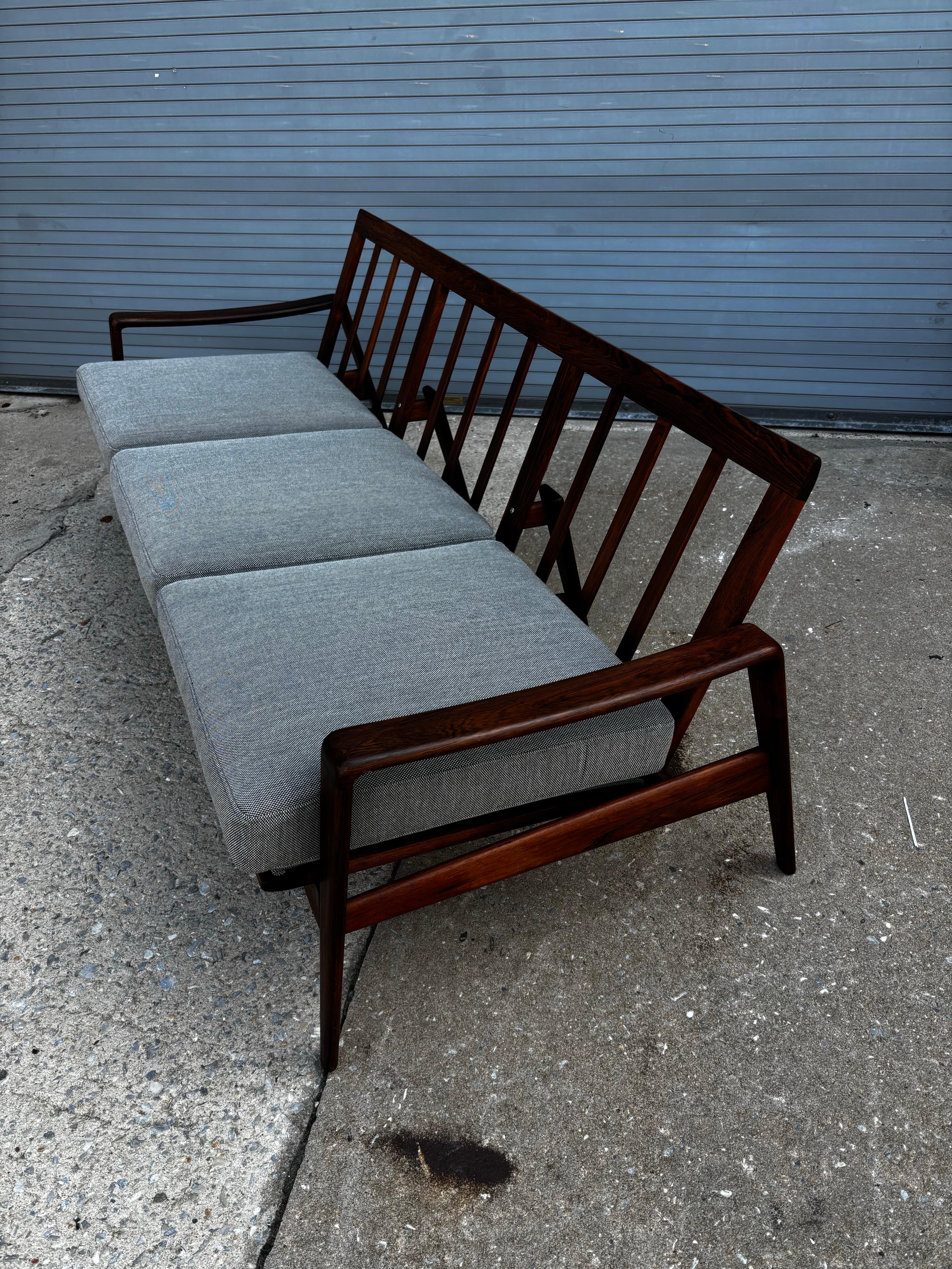 Arne Wahl Iversen Rosewood Sofa.  Manufactured by Komfort, Model no. 35.  Original wood finish in great shape and newly upholstered cushions bring this amazing scale Sofa up-to-date!  Solid design with great detail to construction!