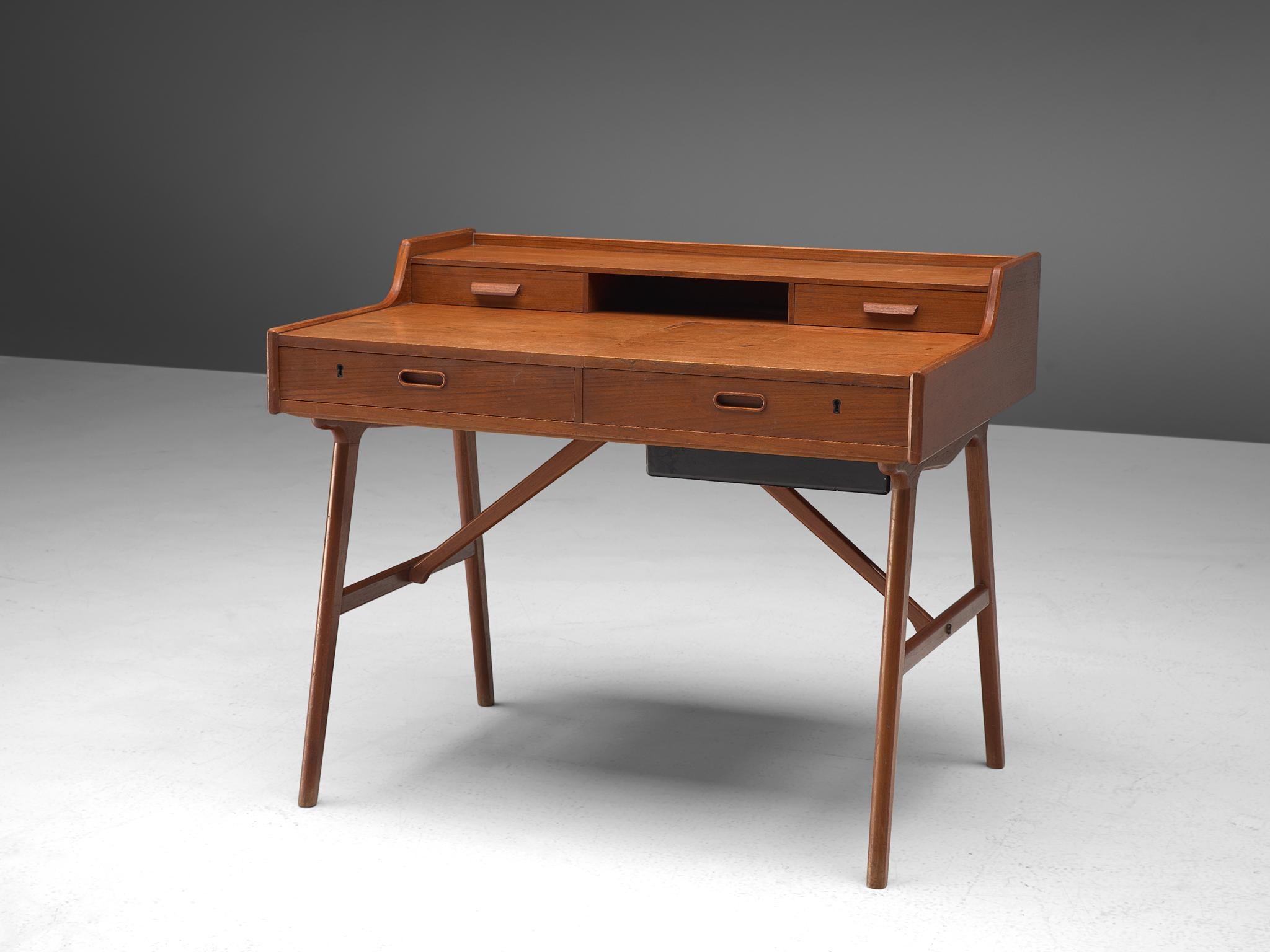 Arne Wahl Iversen for Vinde Møbelfabrik, desk model 65, teak, Denmark, circa 1961.

Refined vanity table by Danish designer Arne Wahl Iversen. This small writing table has a beautiful open look due the high cylindrical legs. The table with two