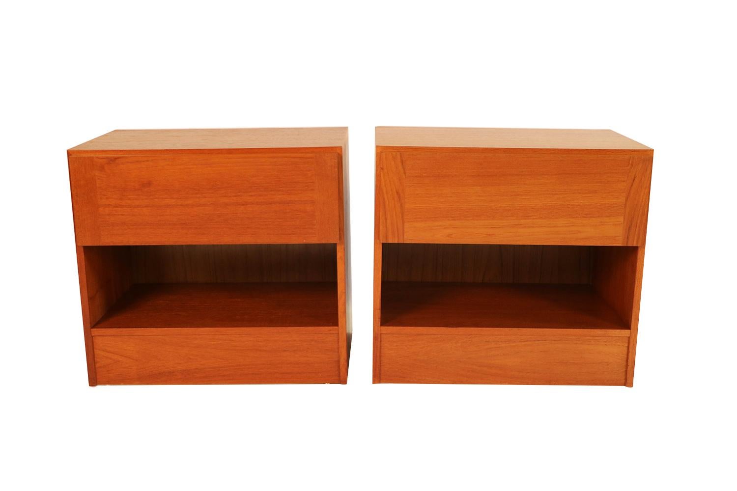 These Scandinavian Modernist, teak Danish tables were produced in Denmark by Vinde Møbelfabrik and designed by Arne Wahl Iversen, circa 1970s, elegant design with clean straight lines that make them sleek, minimalist pieces with functionality,