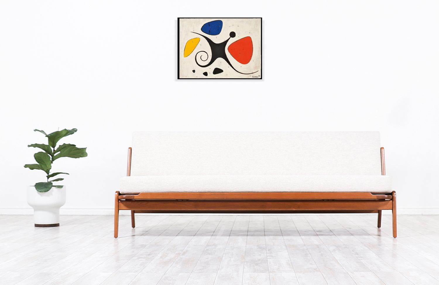 Elegant Mid-Century Modern sofa designed by Danish architect and designer Arne Wahl Iversen for Komfort in Denmark circa 1960s. This comfortable design features a quality crafted teak wood base with geometric shapes and a perfectly balanced seat