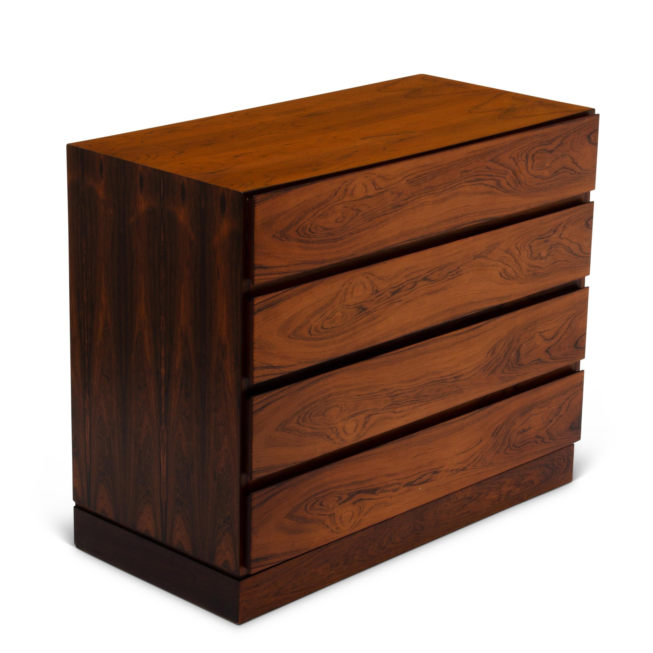 A midcentury Danish Arne Wahl Iversen for Vinde Møbelfabrik model 121 midcentury bachelor's chest or lowboy dresser. What is unique about this piece is that the sides and front of the case are in a dark Brazilian rosewood while the drawer fronts and