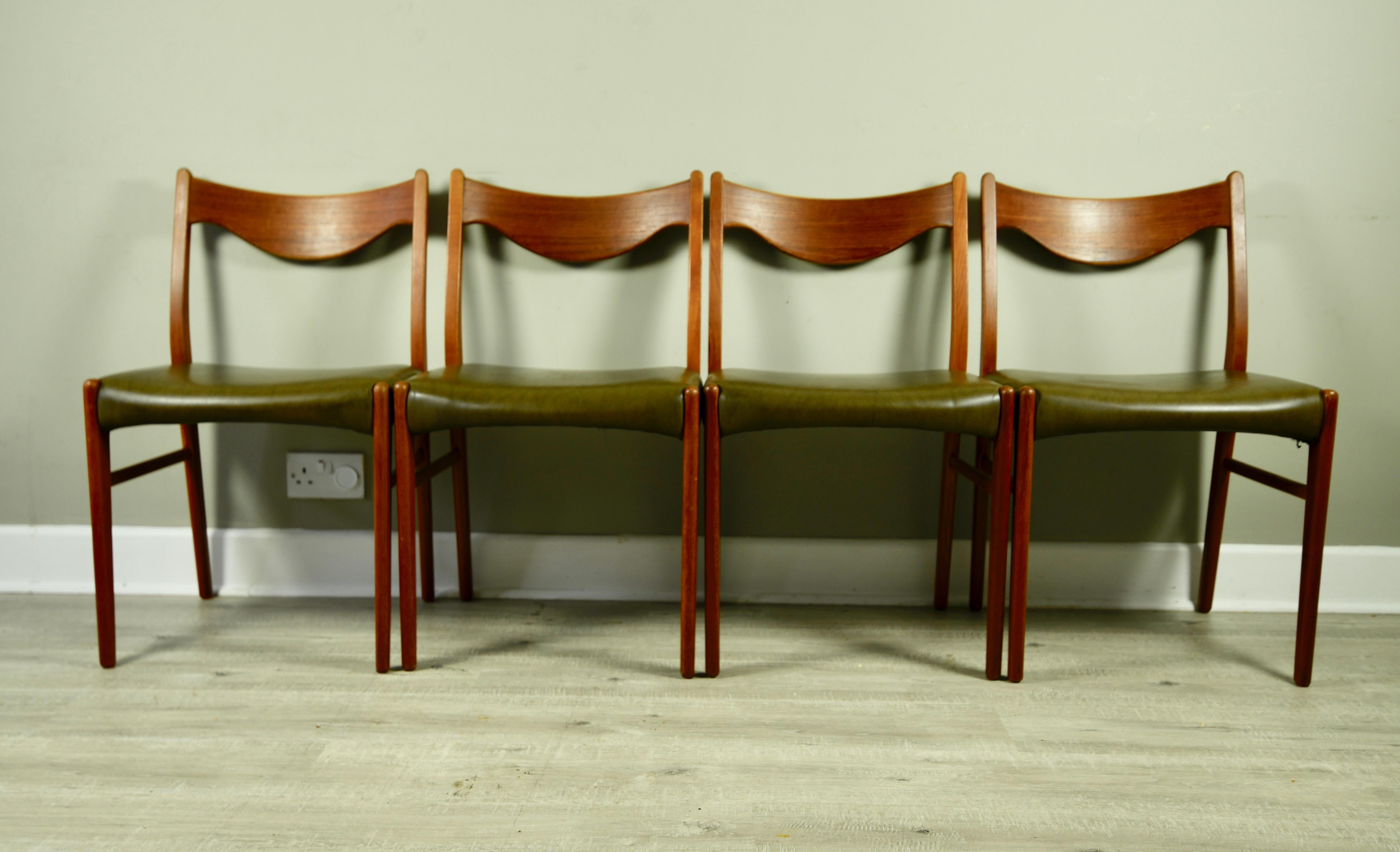 Set of four stunning, Mid-Century Modern teak dining chairs. They were manufactured by Glyngøre Stolefabrik, and designed by Arne Wahl Iversen. They are all stamped 