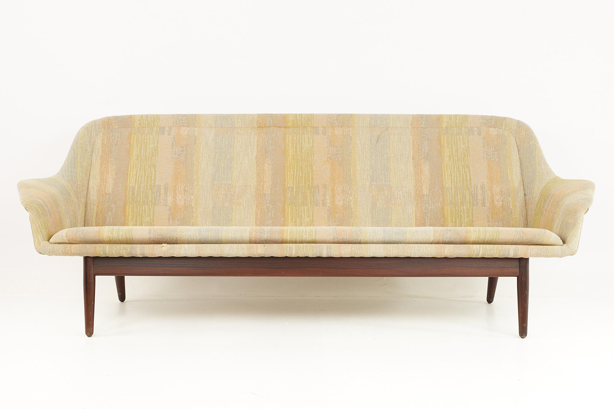 Arne Vodder for George Tanier mid century Danish walnut loveseat

This loveseat measures: 89.5 wide x 27 deep x 31 inches high, with a seat height of 16 and arm height of 21.5 inches

All pieces of furniture can be had in what we call restored