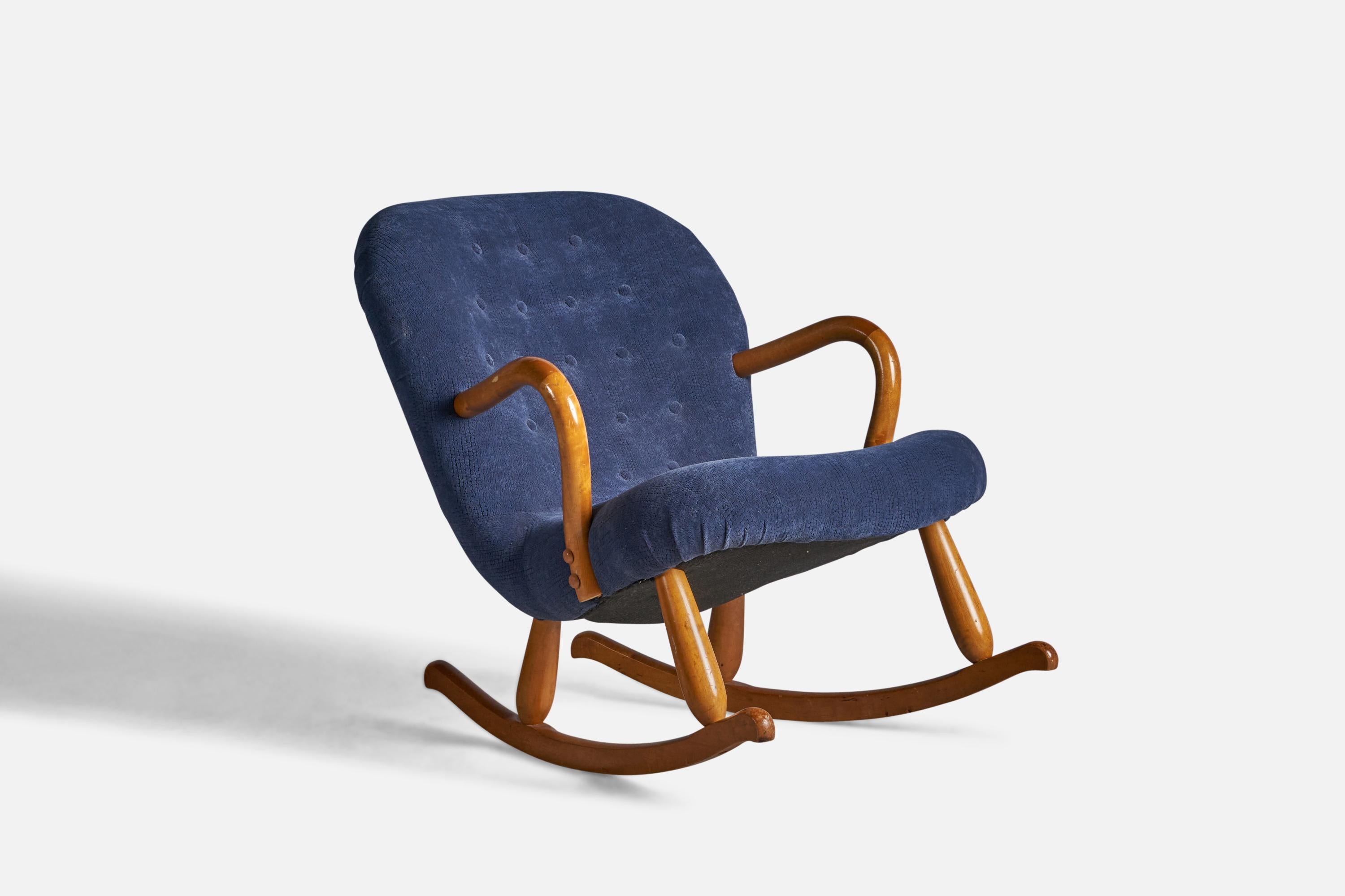 A birch and blue fabric rocking lounge chair attrubuted to Arnold Madsen, Denmark, 1950s.

18