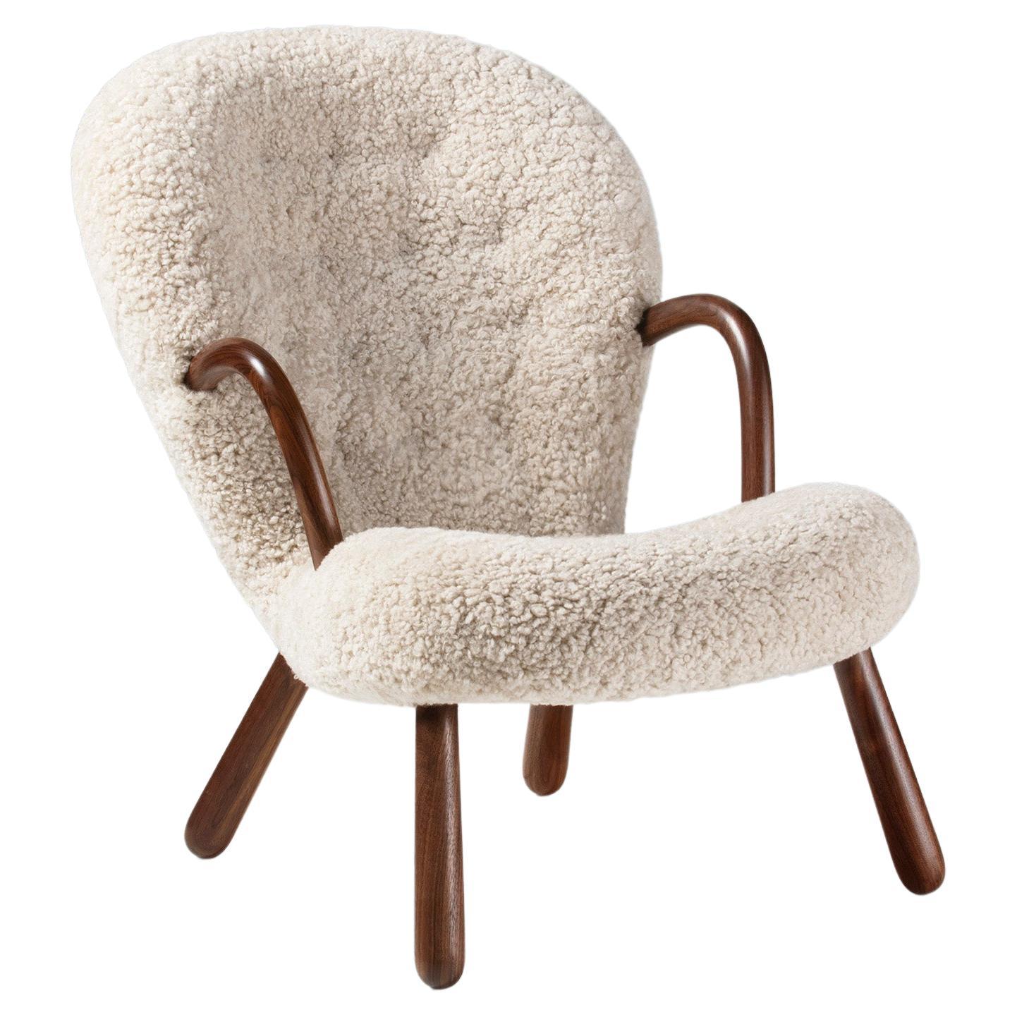 Who designed the clam chair?