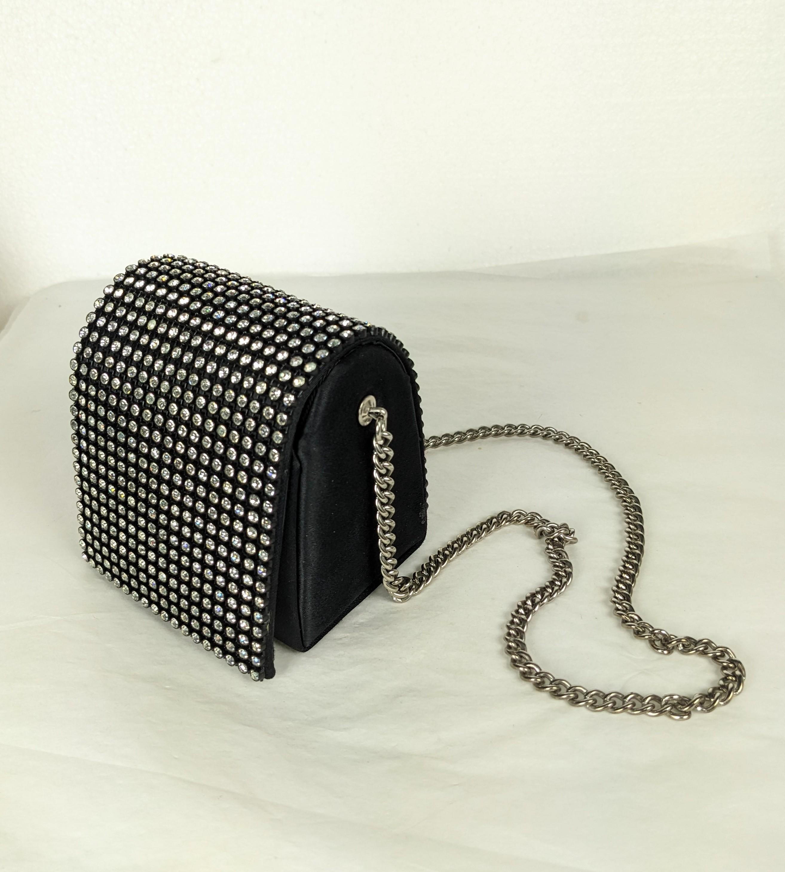 Charming Arnold Scassi Pave Mini Cube Novelty Bag from the 1960's which holds very little, maybe a lipstick, a flip phone and some tissues. Rhinestone trimmed flap, Satin exterior, faille lining. Silvertone chain. 1960's USA.  3.5