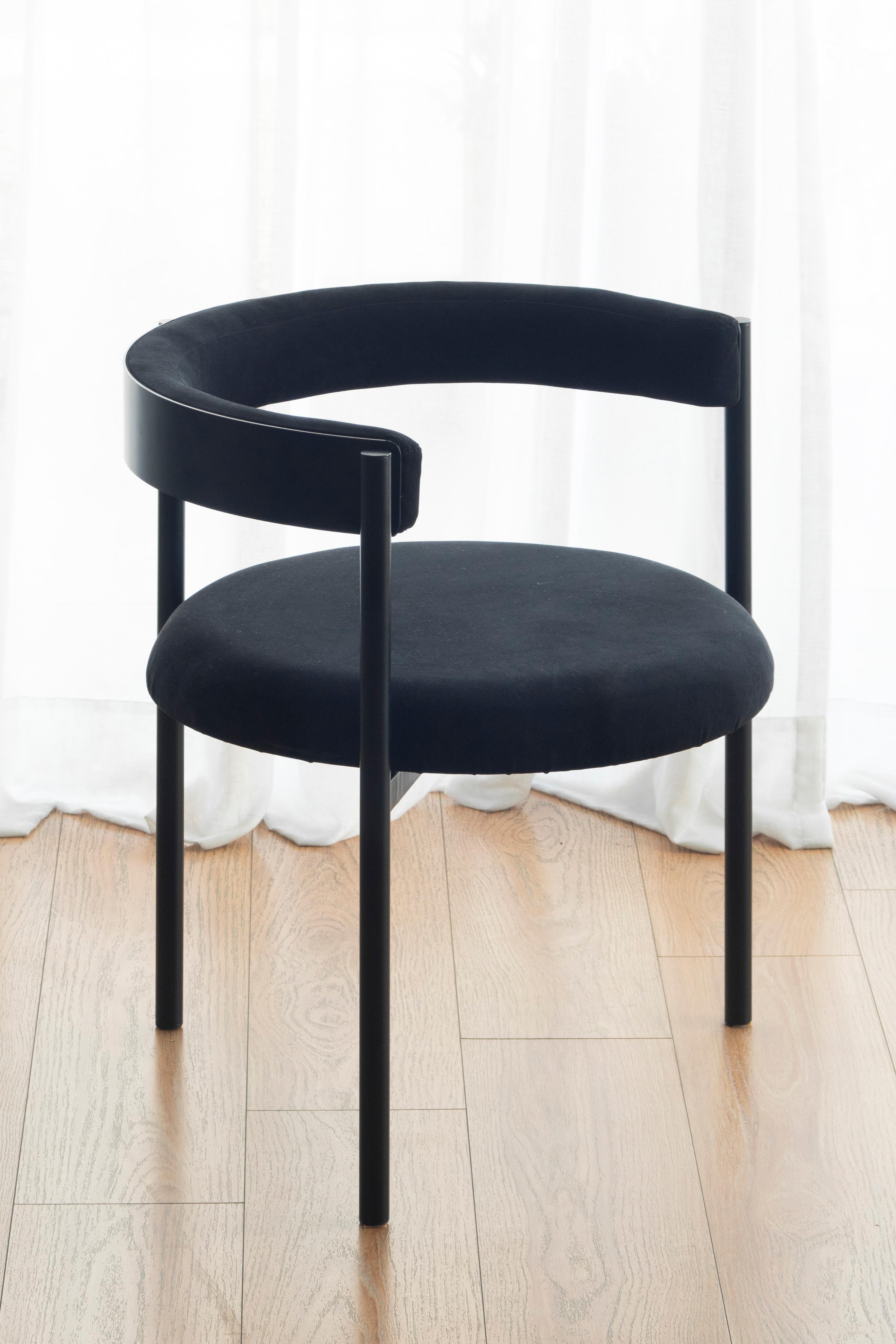 Aro chair, black by Ries
Dimensions: W60 x D60 x H67,5 cm 
Materials: Round steel tube, high-density foam, and velvet upholstery

Also available: Merlot, dark blue, mika, oceano, pink and yellow

Ries is a design studio based in Buenos Aires,
