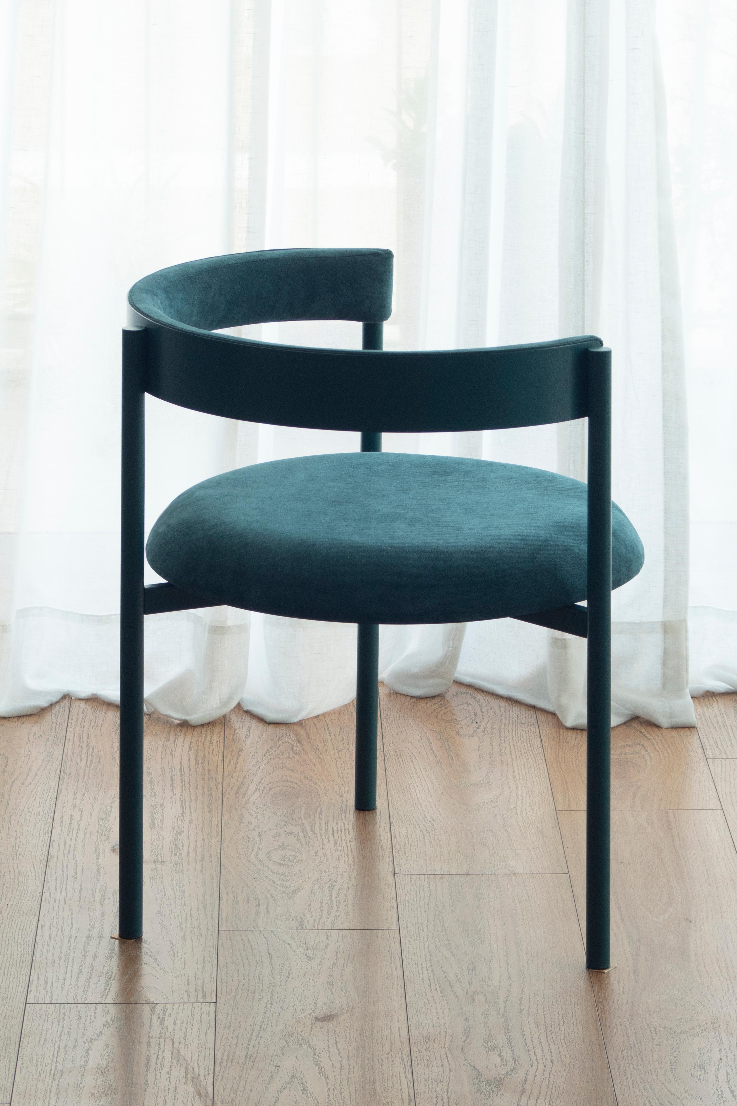 Aro chair, oceano by Ries
Dimensions: W60 x D60 x H67,5 cm 
Materials:Round steel tube, high-density foam, and velvet upholstery.

Also available: Merlot, black, yellow, mika, pink, and dark blue.

Ries is a design studio based in Buenos