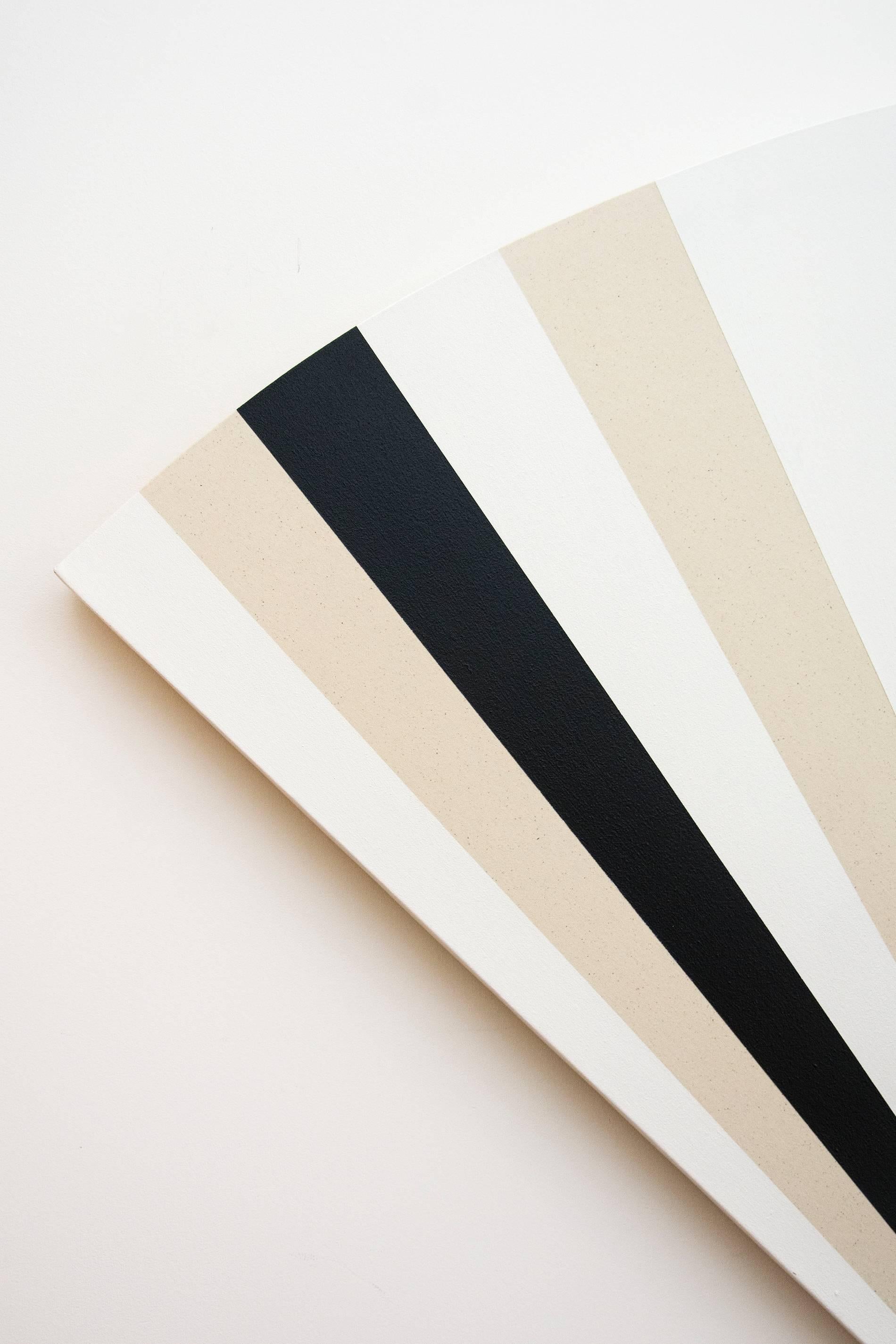 Aron Hill's paintings consist of layers of acrylic ink washes on clear primed raw canvas. This hard edge, black, white and raw canvas painting is particularly sculptural as it is painted on a fan shaped stretcher, and with a repetitive pattern